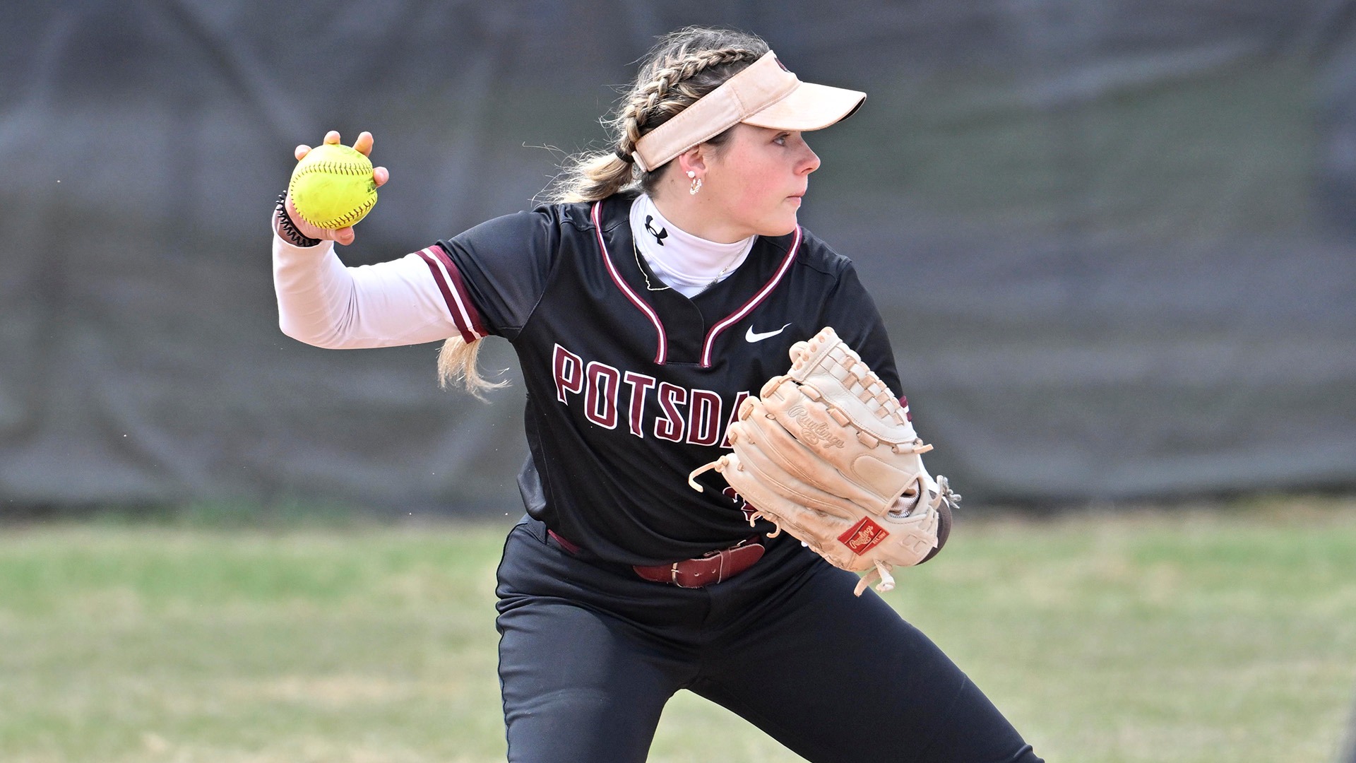 Kaylee Dobransky throws to first against Fredonia on 4/12/25.