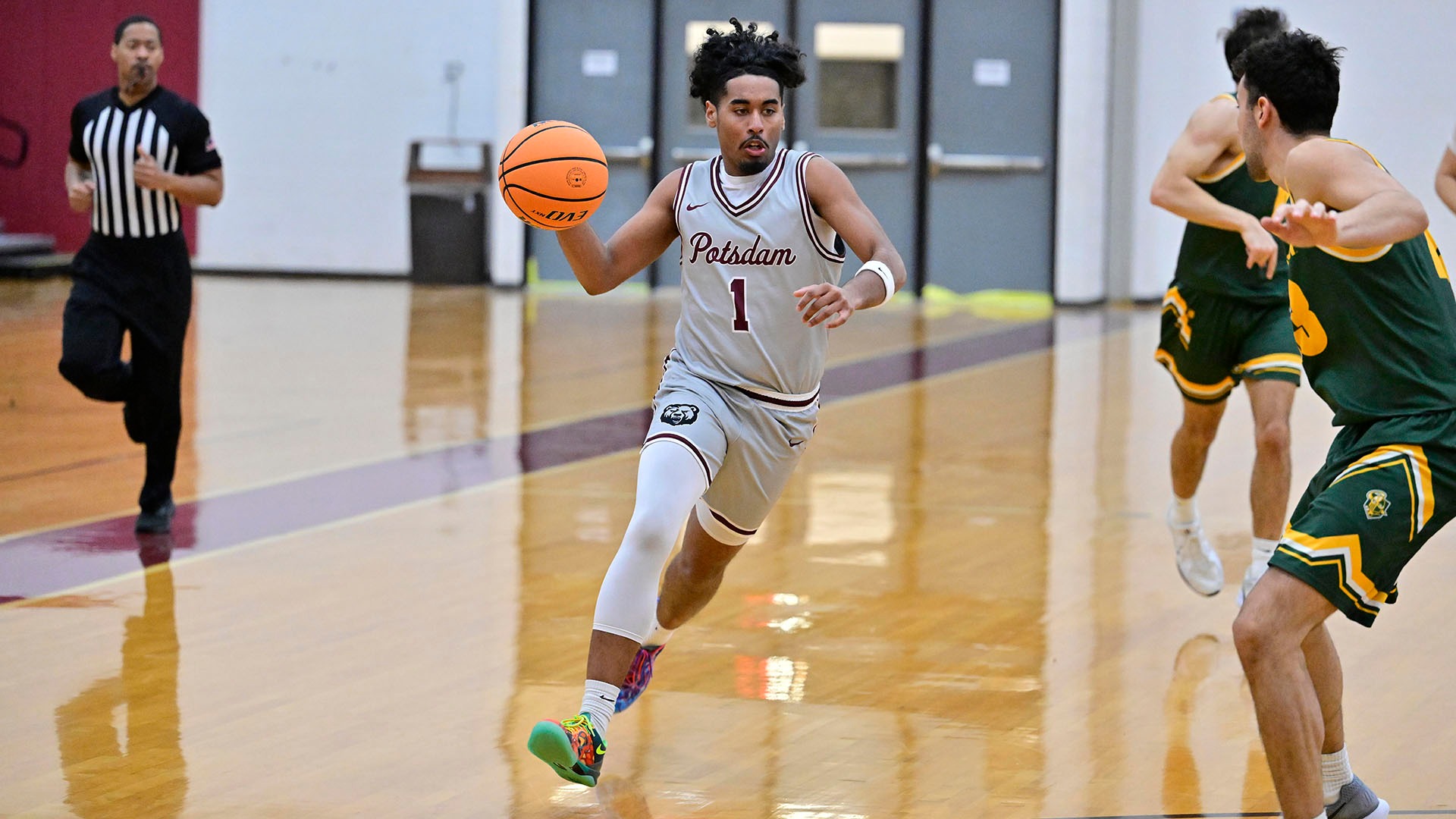 Ethan Baksh drives to the basket against Clarkson on 11/25/25.