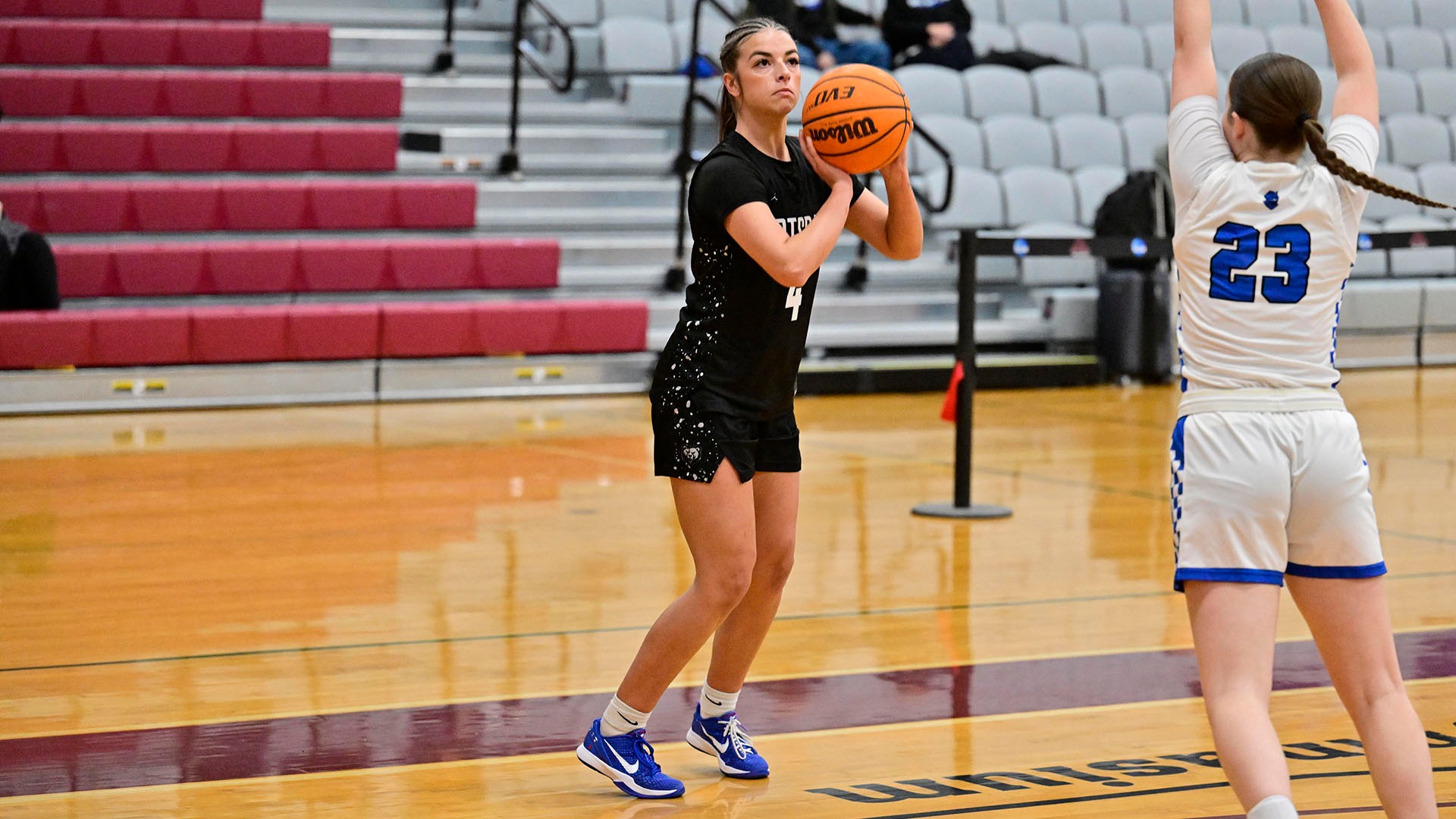 Lucie Scarpine shoots a 3-pointer against Fredonia on 12/6/25.