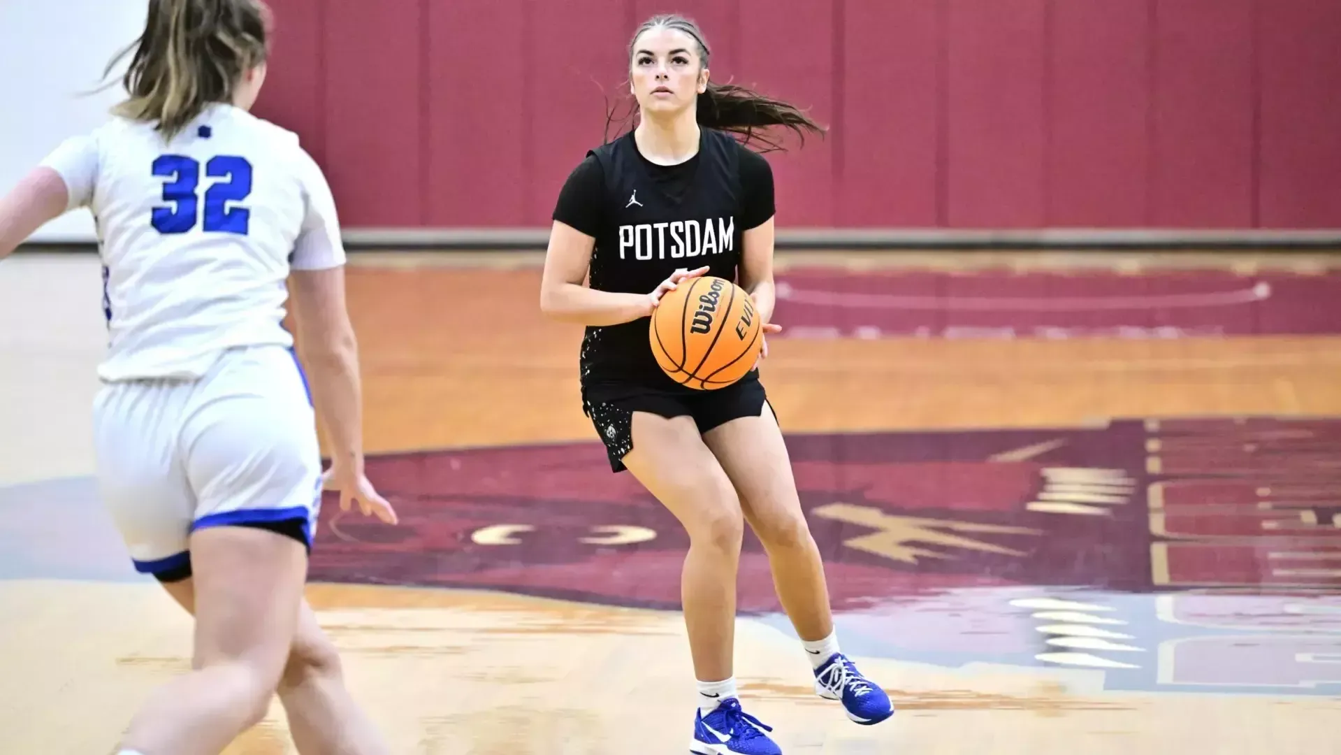 Lucie Scarpine sets up for a shot against Fredonia on 12/06/25. 