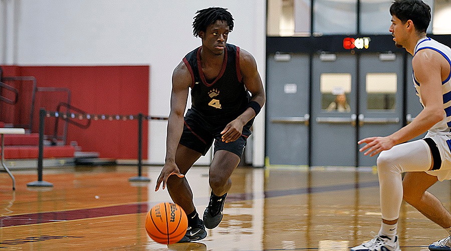 Timothy Hardy moves the ball against Fredonia on 12/6/25.