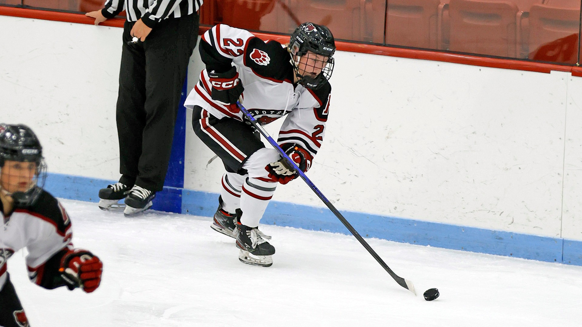 Megan Mills carries the puck against William Smith on 11/15/25.