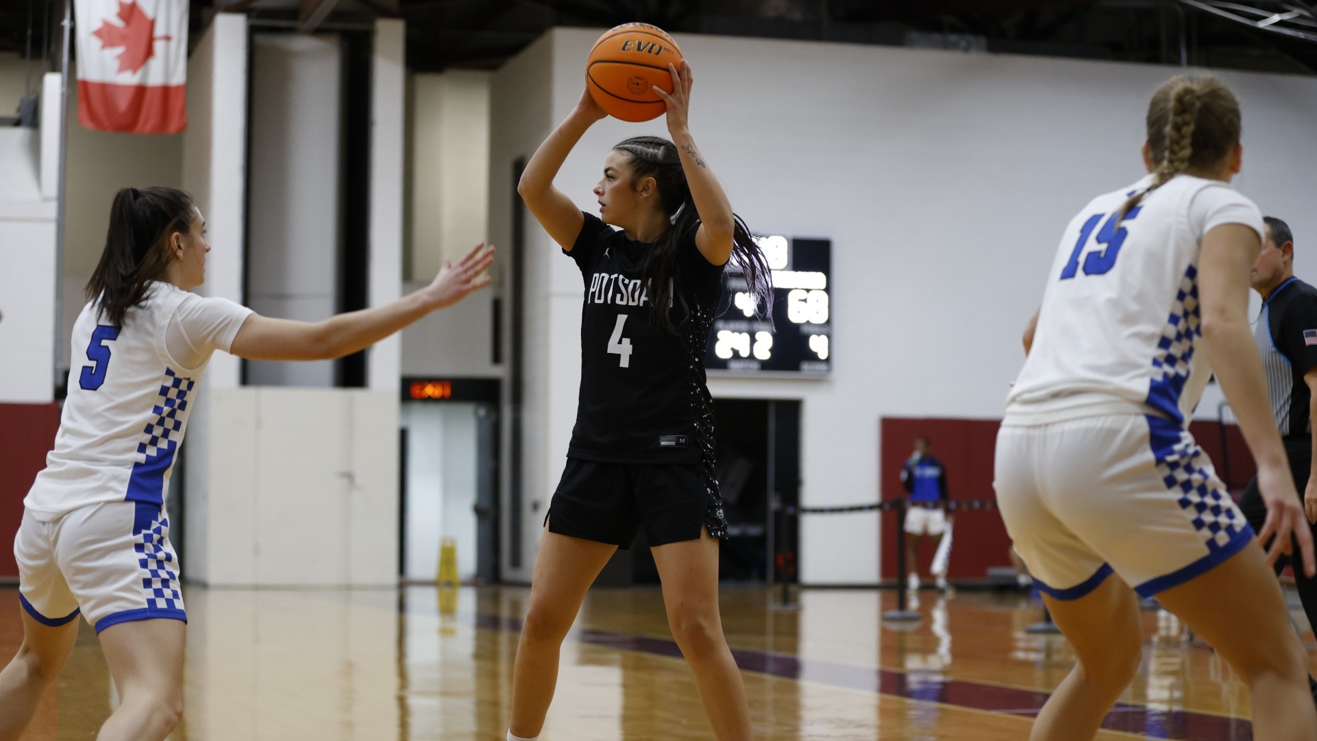 Lucie Scarpine looks for a pass against Fredonia on December 6, 2025. 
