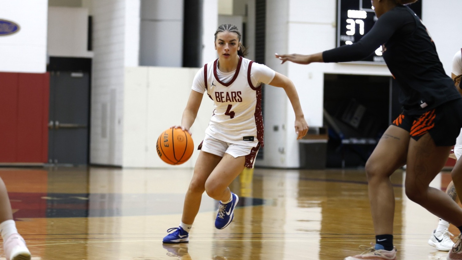 Lucie Scarpine dribbles through the Buffalo State defense on December 5, 2025. 