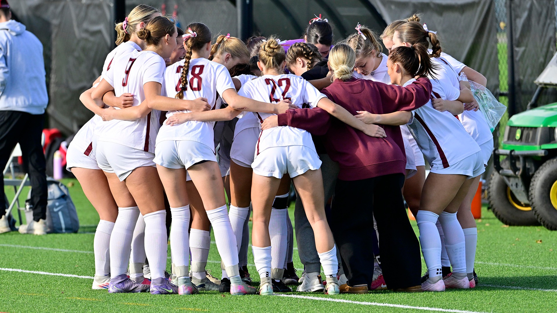 The women's soccer team huddles during a contest with Oneonta on 10/7/26.