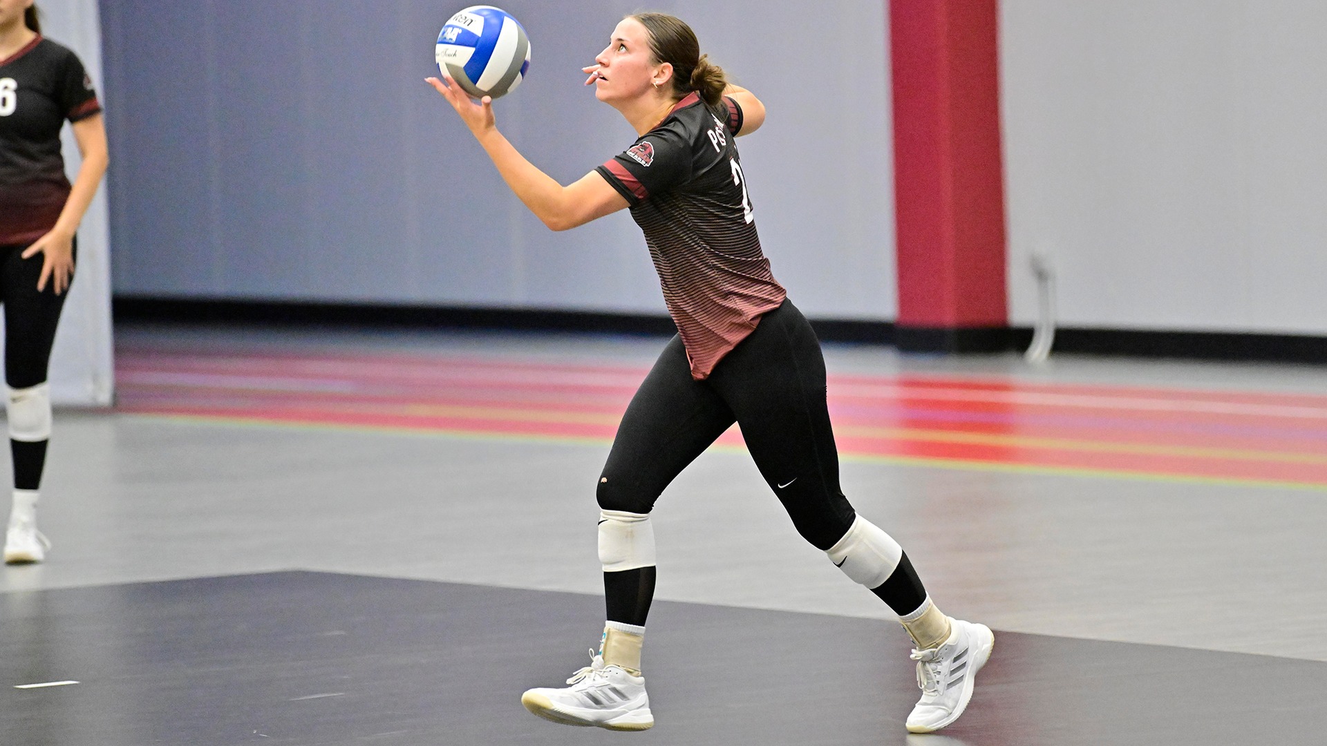Ashlee Hagerman serves against Johnson on 9/18/26.