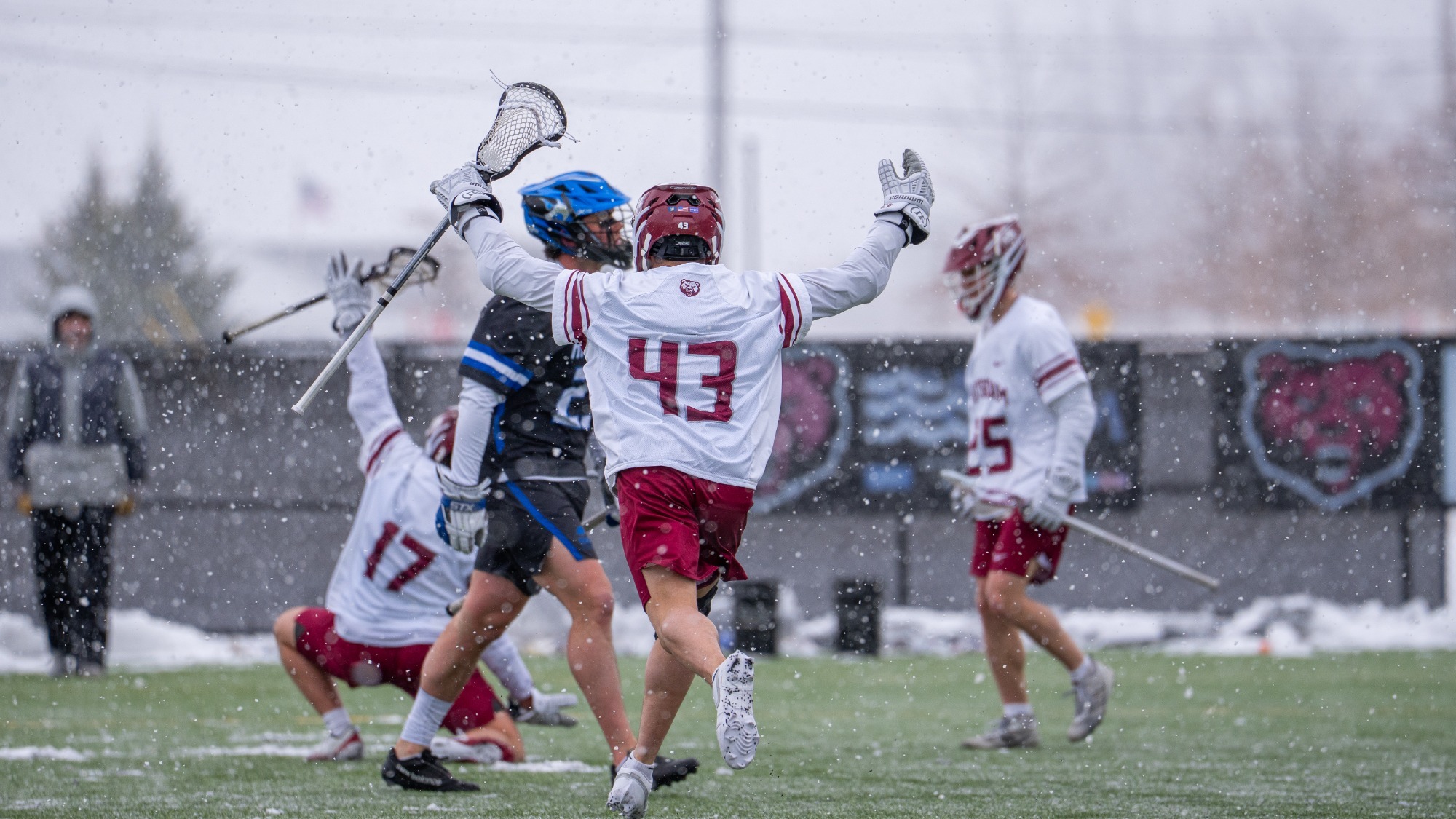 The Bears celebrate a goal in the snow against Hartwick in 3/14/26.