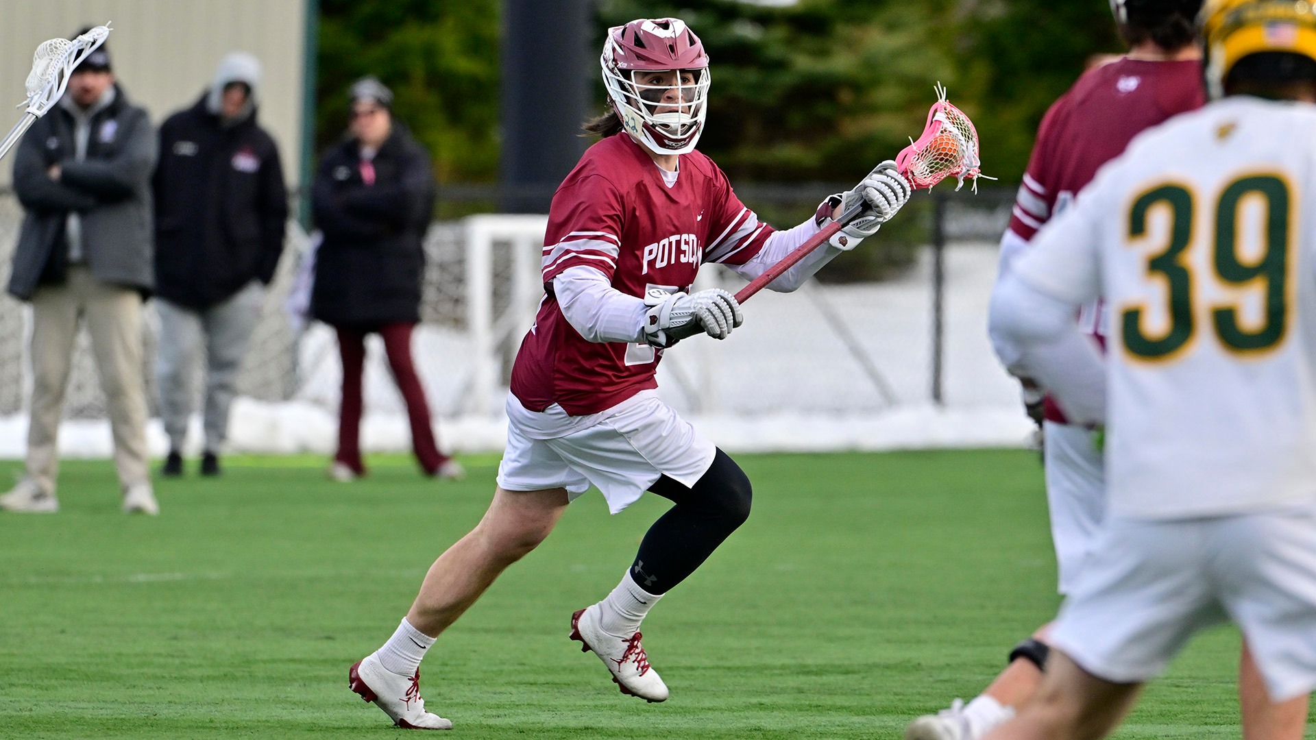 Billy Kozloski carries the ball against Clarkson on 3/24/26.