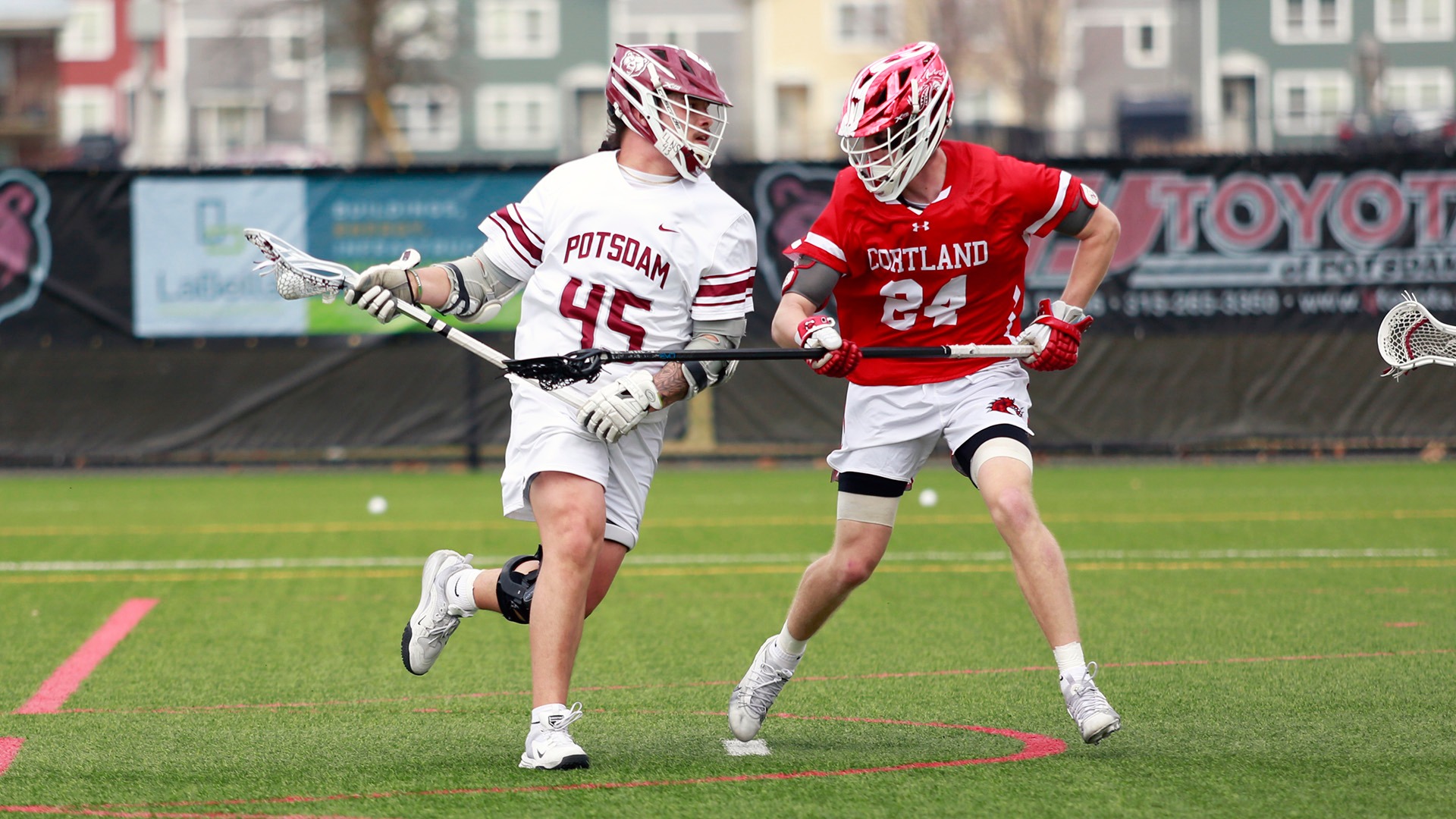 Rowisonkies Barnes carries the ball against Cortland on 040326.