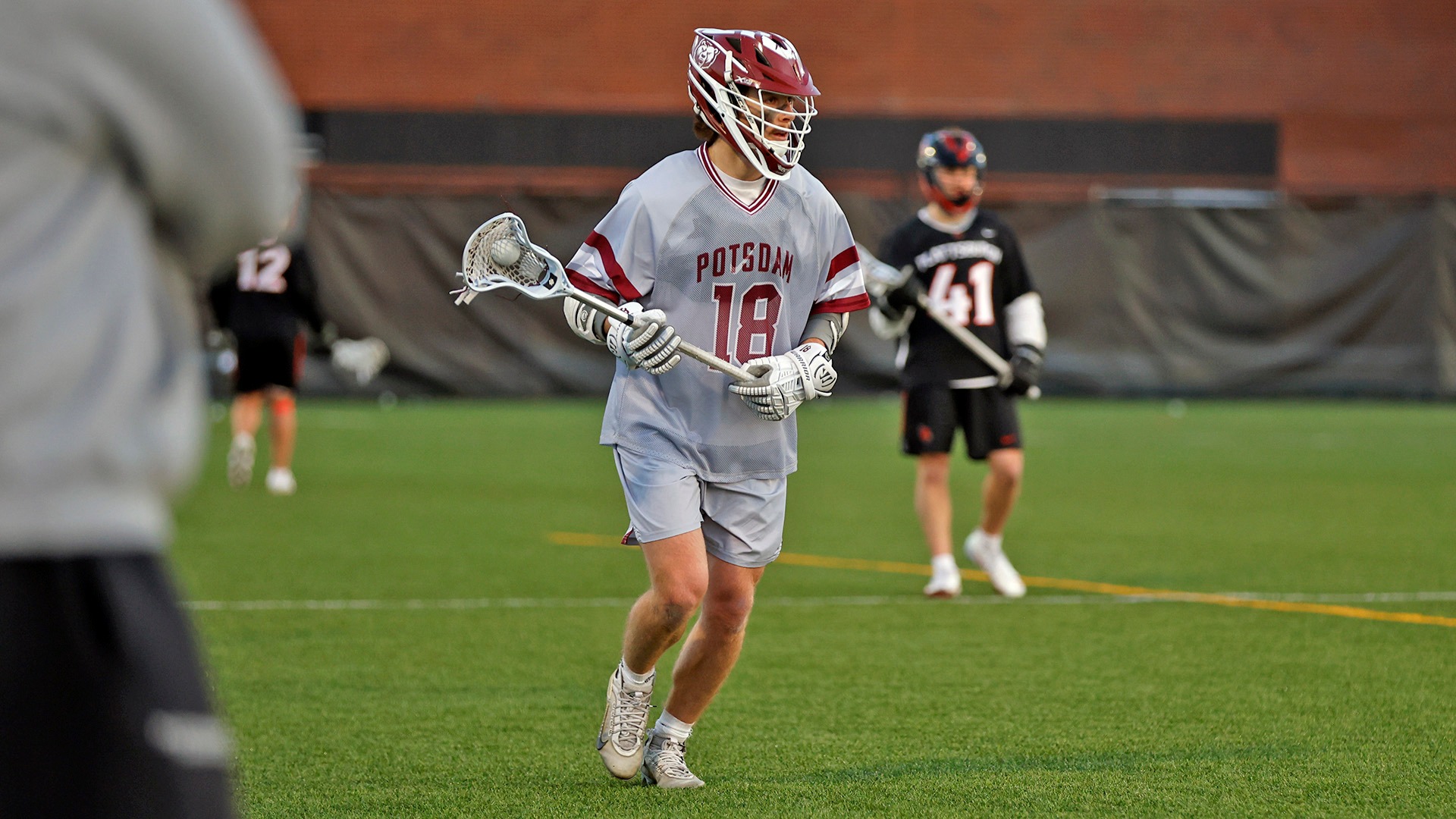 Morgan Fox carries the ball against Plattsburgh on 4/8/26.