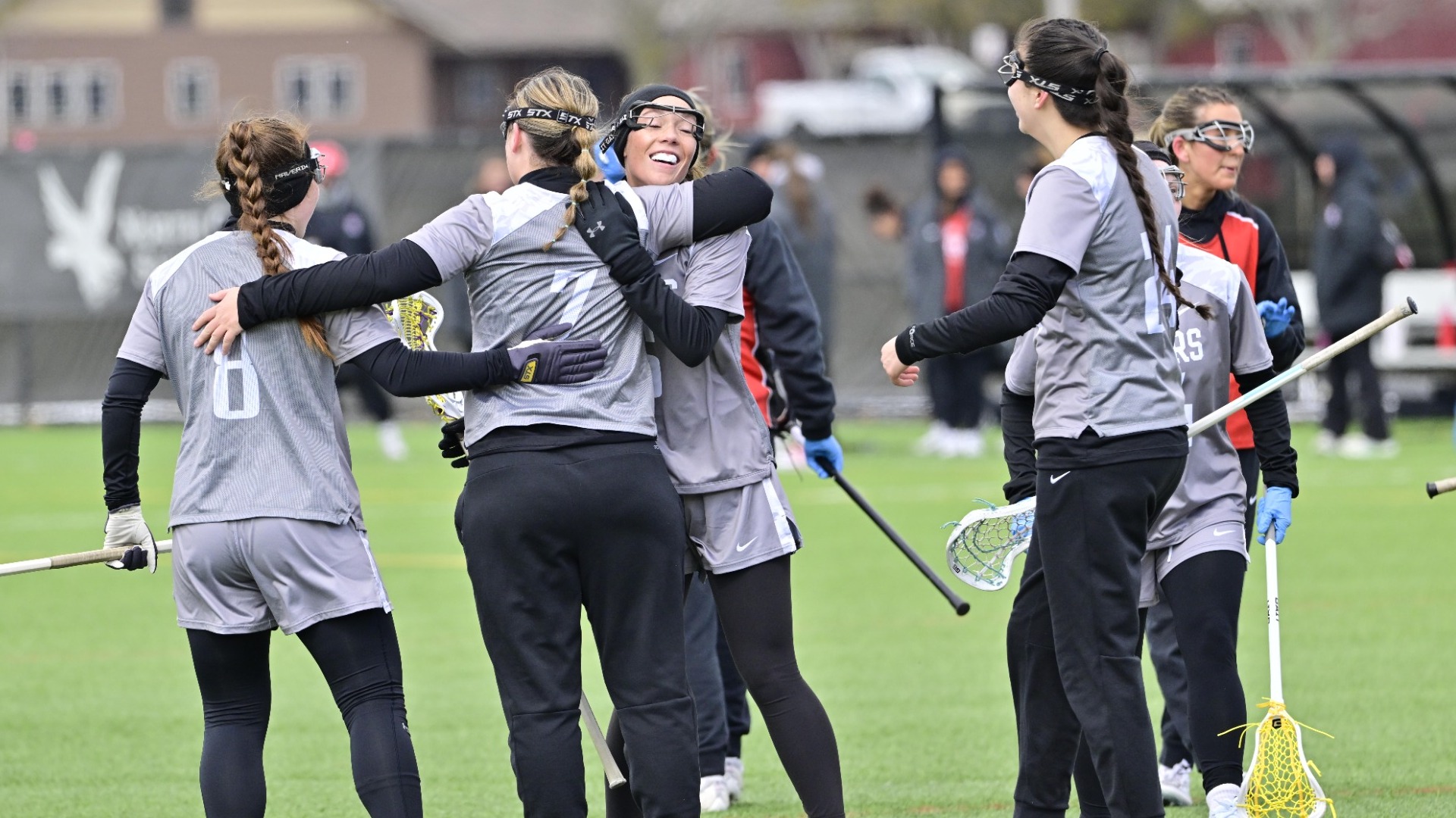 Potsdam women's lacrosse celebrates a goal against Oneonta on 03/28/26. 