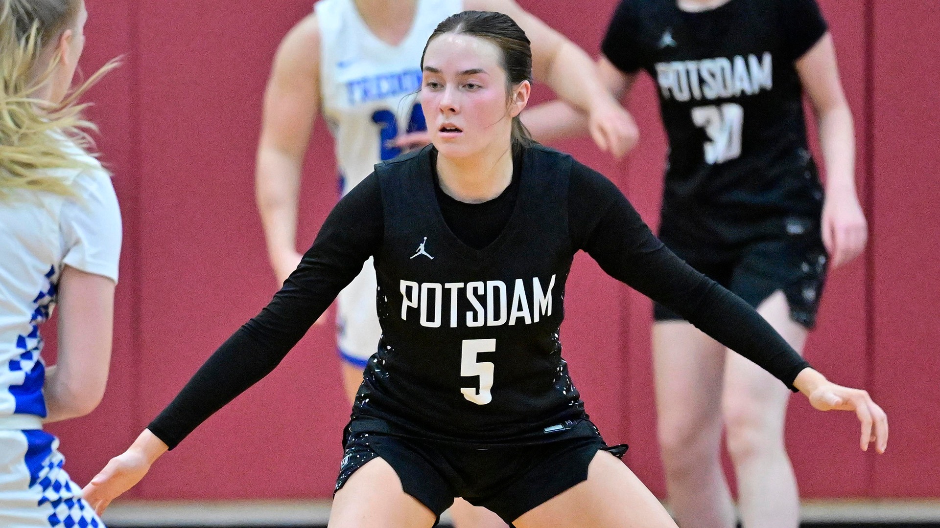 Emily Smith defends against Fredonia on 12/6/25.