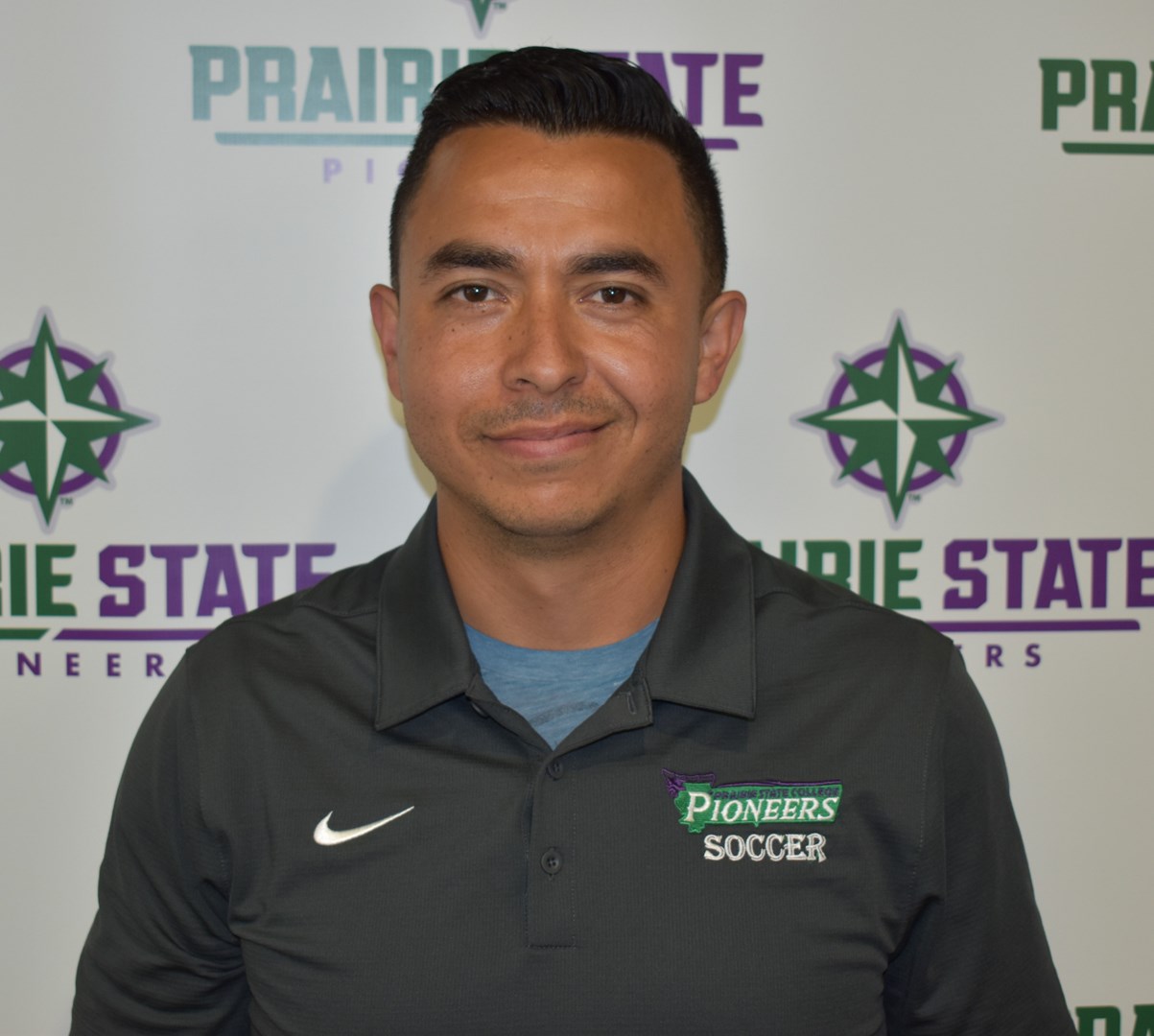 Head Coach Carlos Reyes