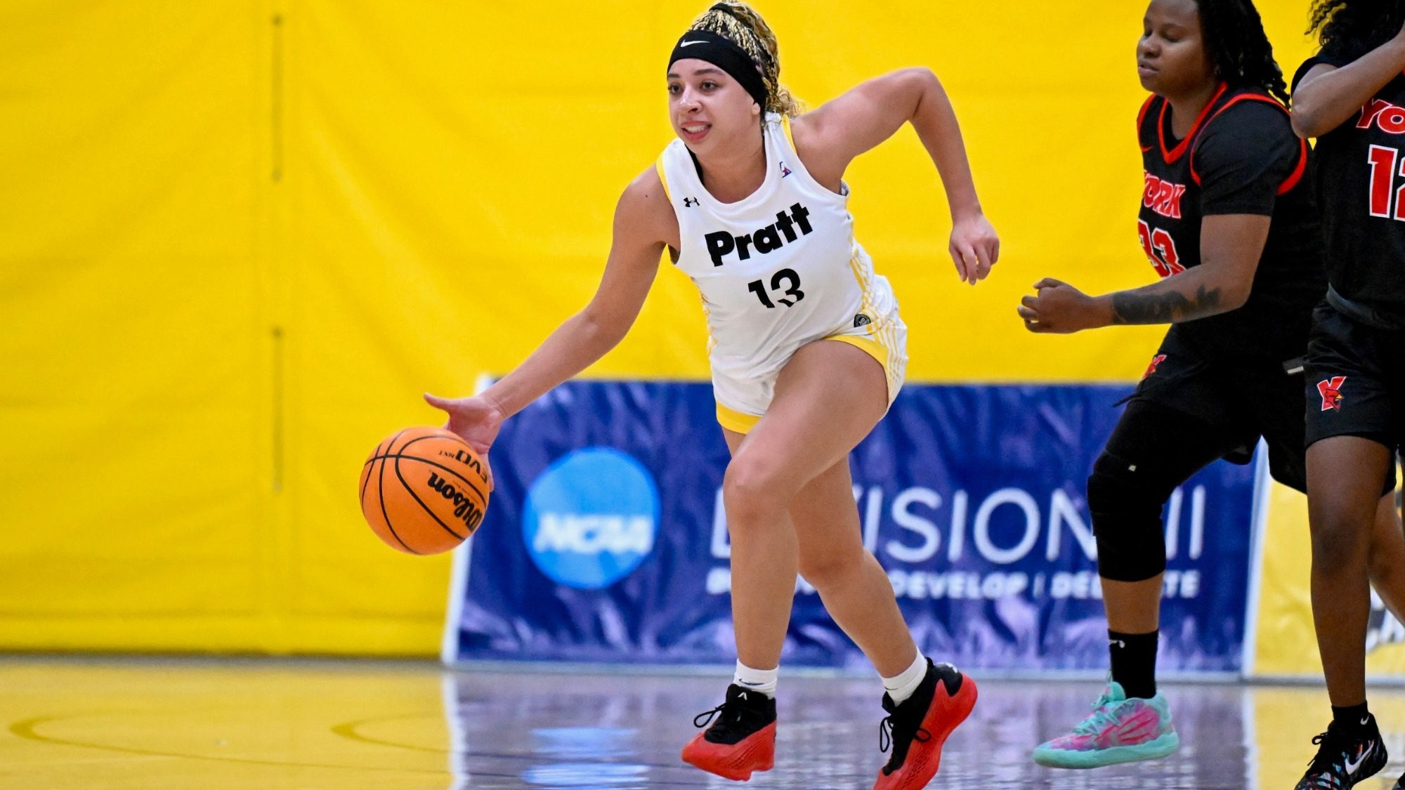 Kylie Grant dribbles away from a York defender in the back court.