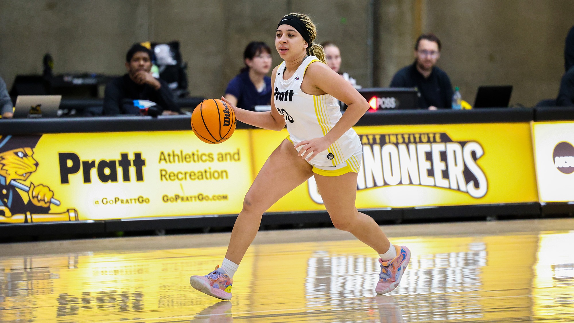 Kylie Grant drives to the basket with her right hand