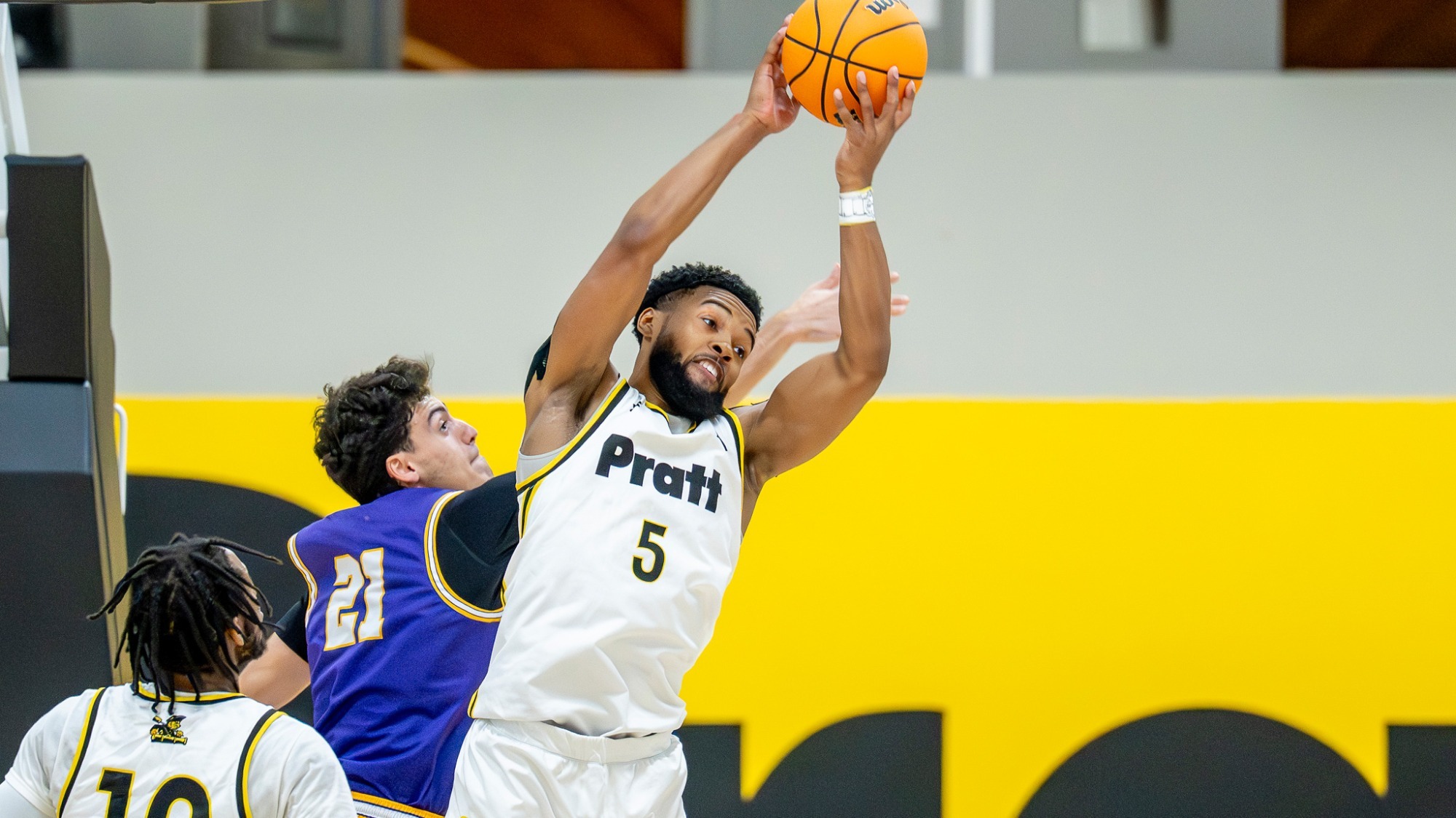 Cameron Hatcher pulls down a rebound with two hands.