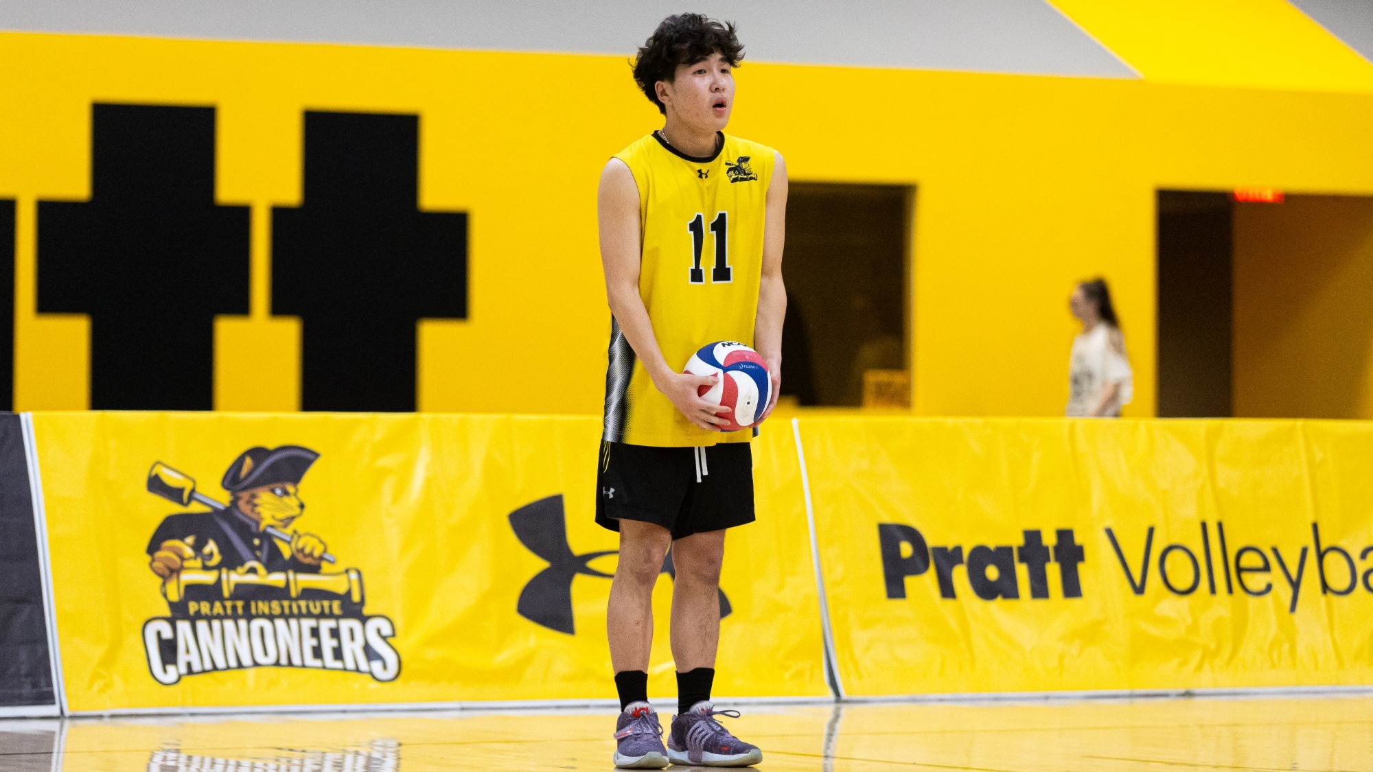 Nathan Kim prepares to serve