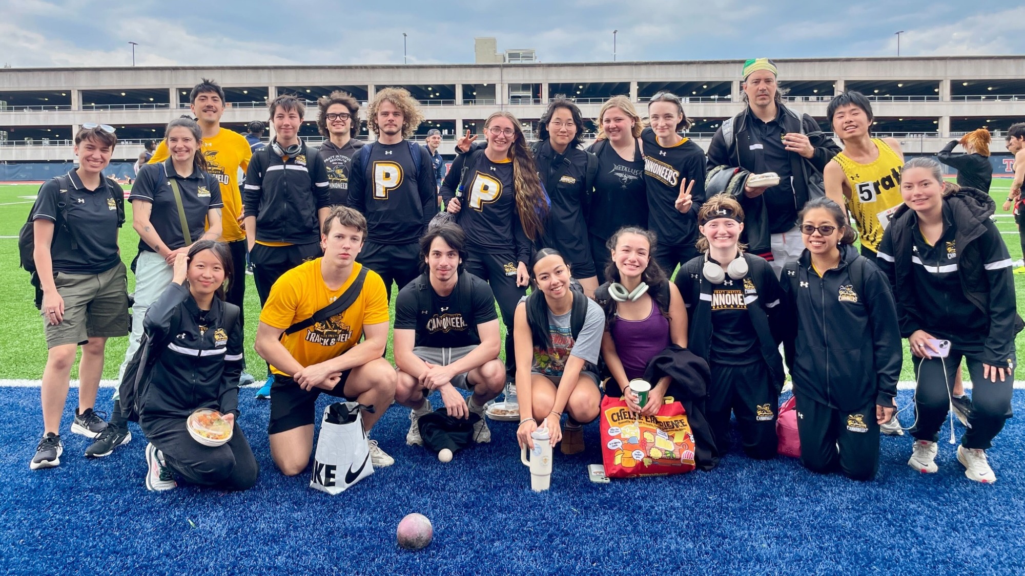 The Pratt Outdoor Track & Field Team poses for a photo after their season opener at The Big Hurt