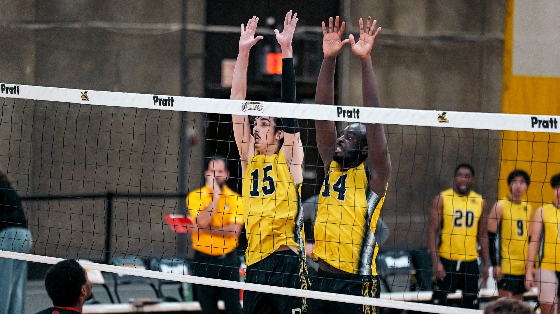 Wallace Hallot and Jason Raymond attempt a block at the net