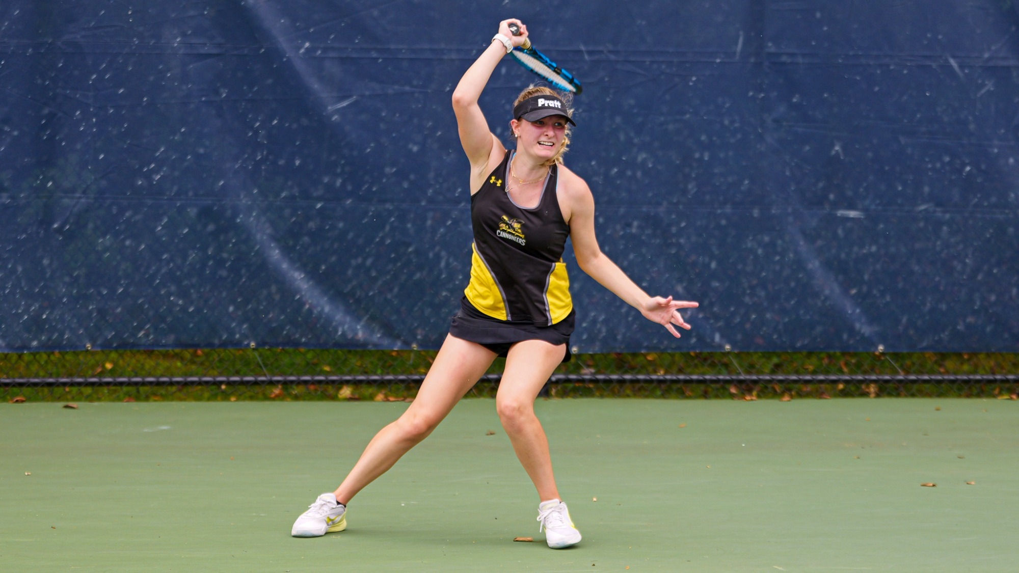Beatrice Crespo follows through with a high finish after hitting a forehand.