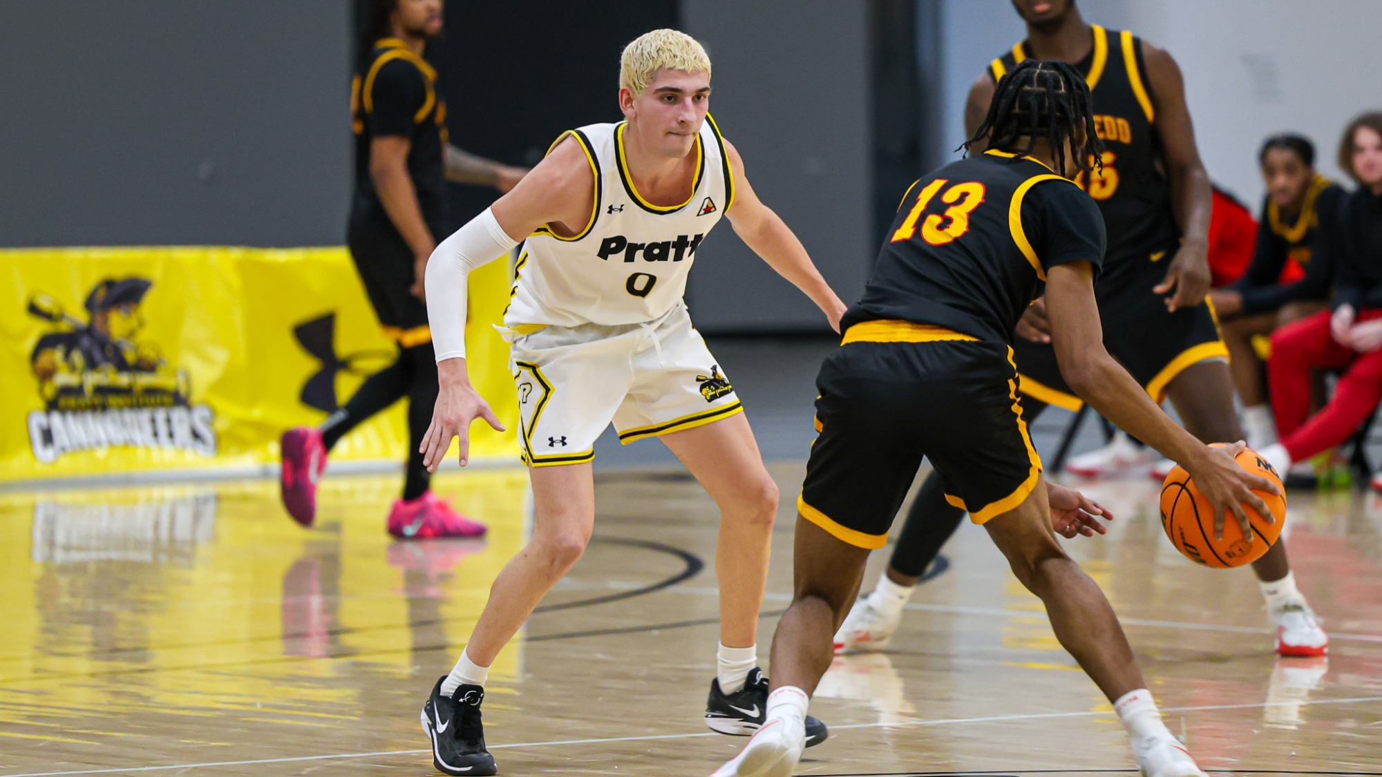 Sebastian Roda plays defense on a Gwynedd Mercy guard