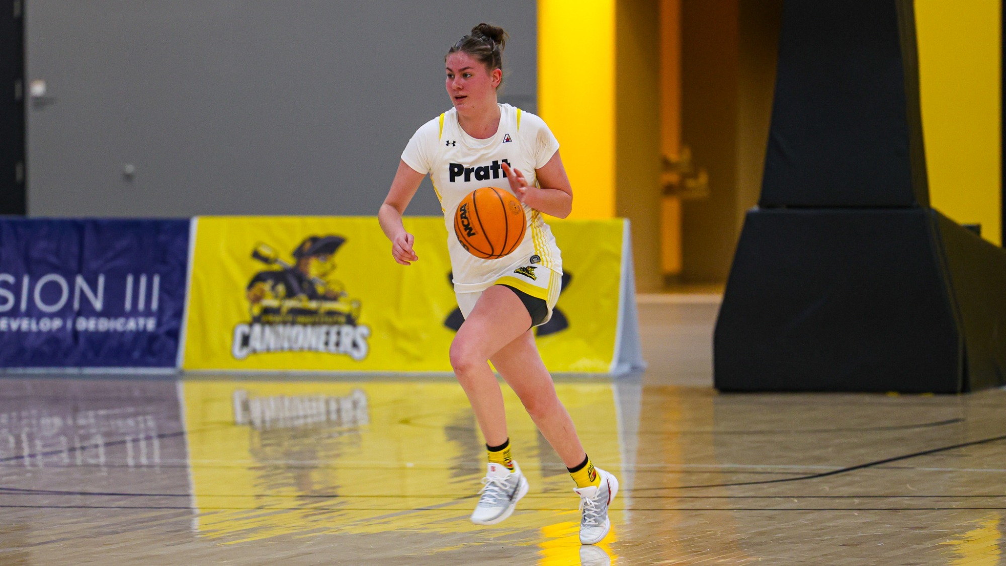 Lola Mactavish dribbles up the ball in the backcourt.