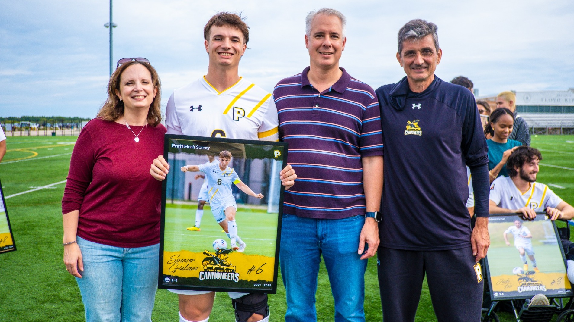Spencer Giuliano with his parents and head coach Stavros Zomopoulos on Senior Day