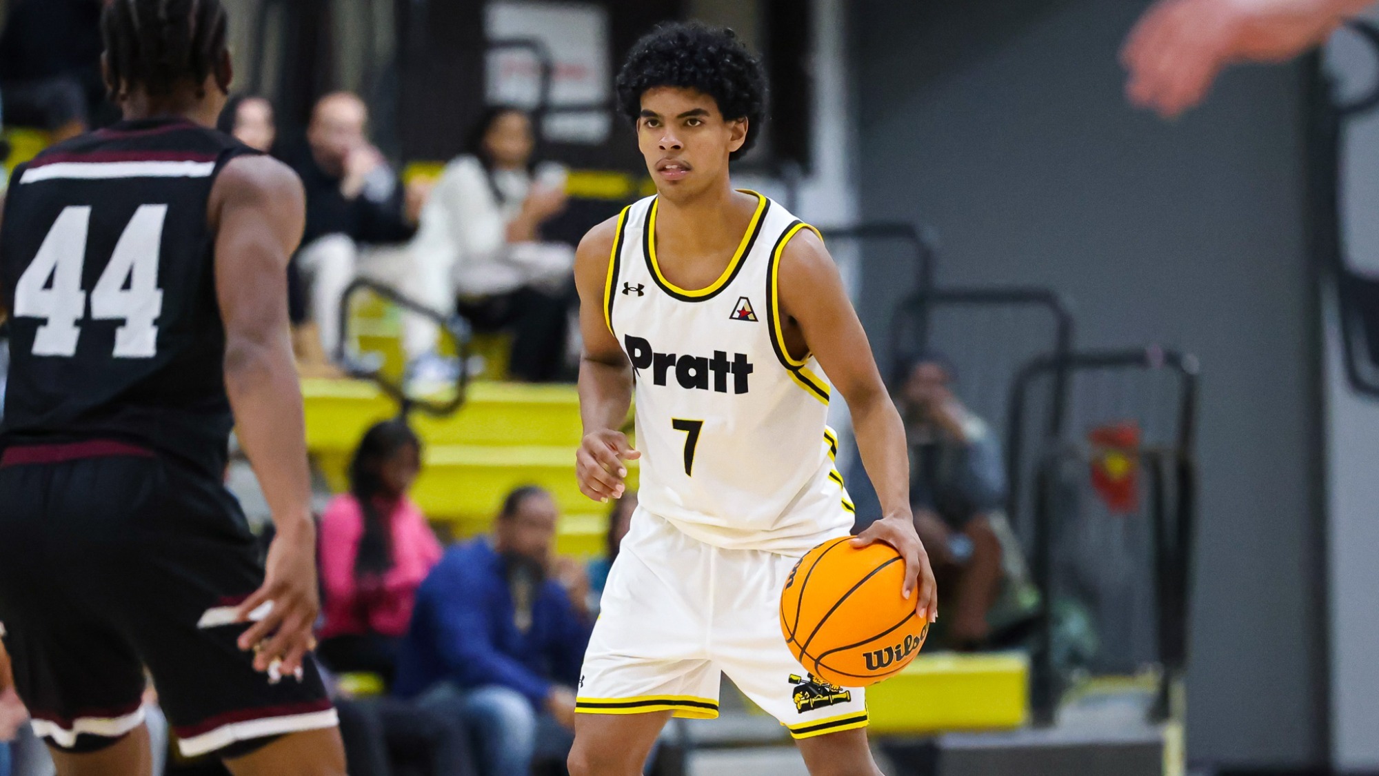 Elijah Fermaint dribbles at the top of the key