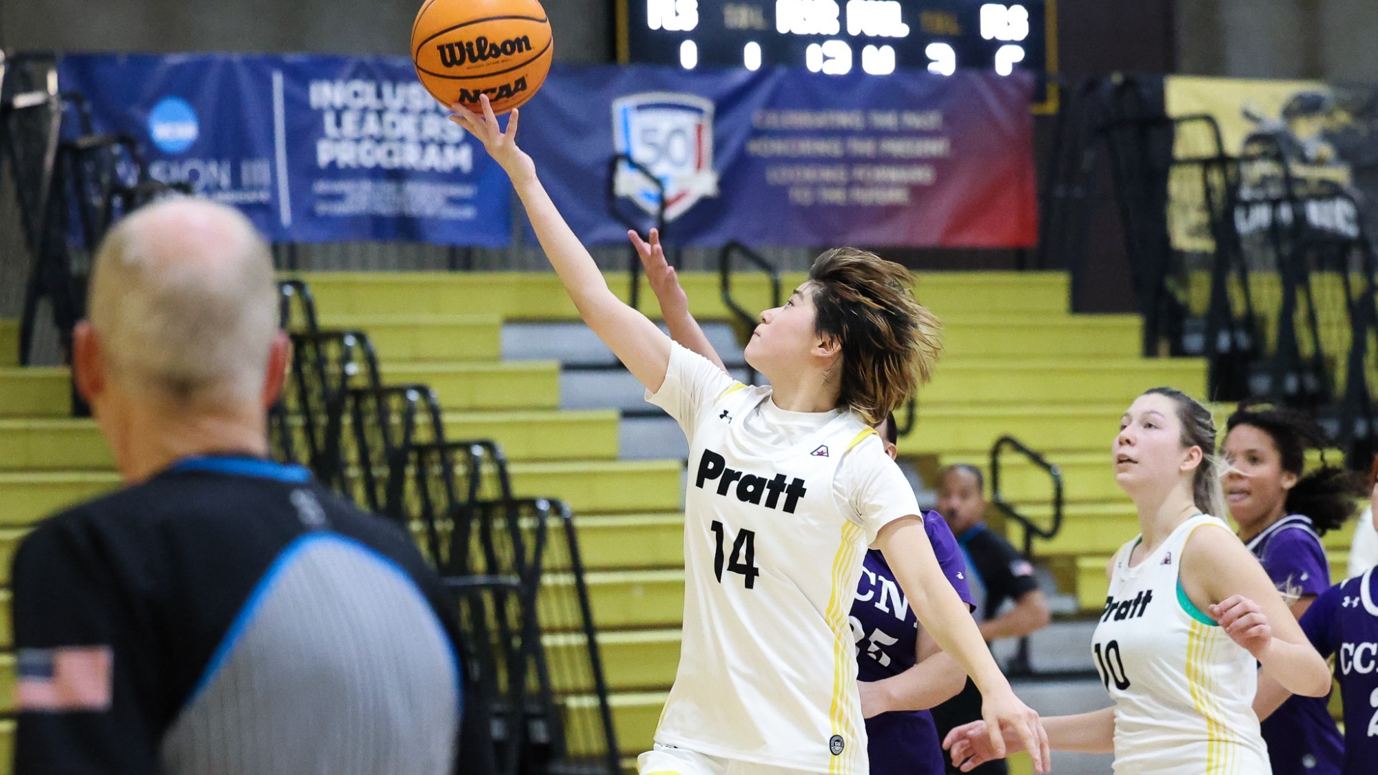 Kaylee Kang drives for a reverse layup