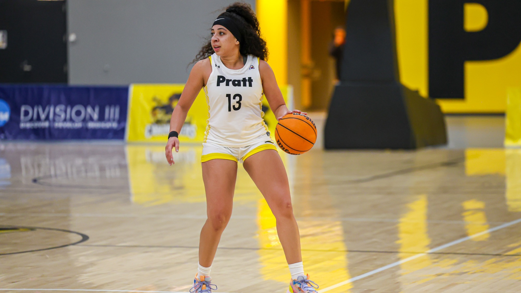 Kylie Grant dribbles with her left hand