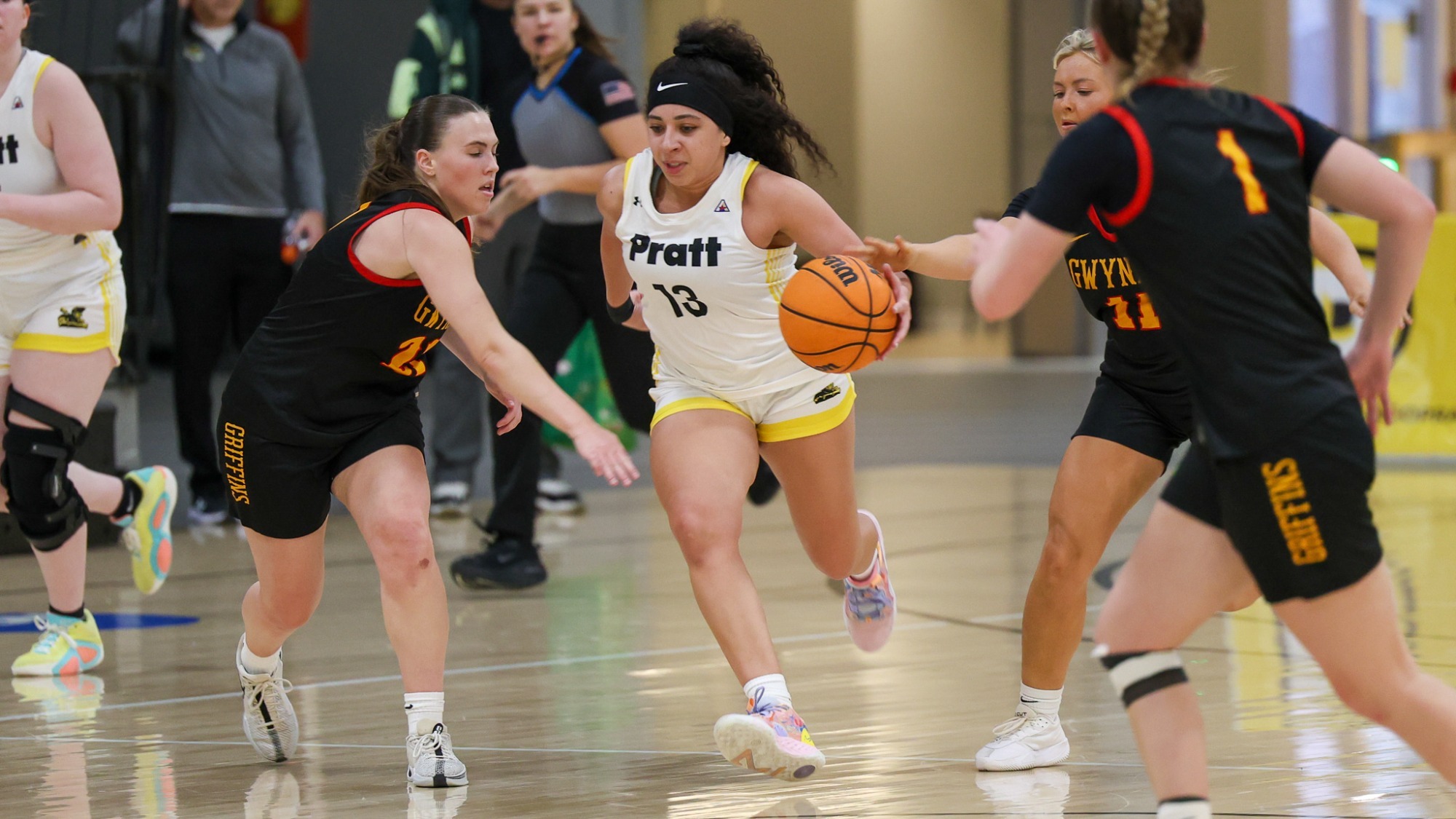 Kylie Grant dribbles through a trio of Gwynedd Mercy defenders.