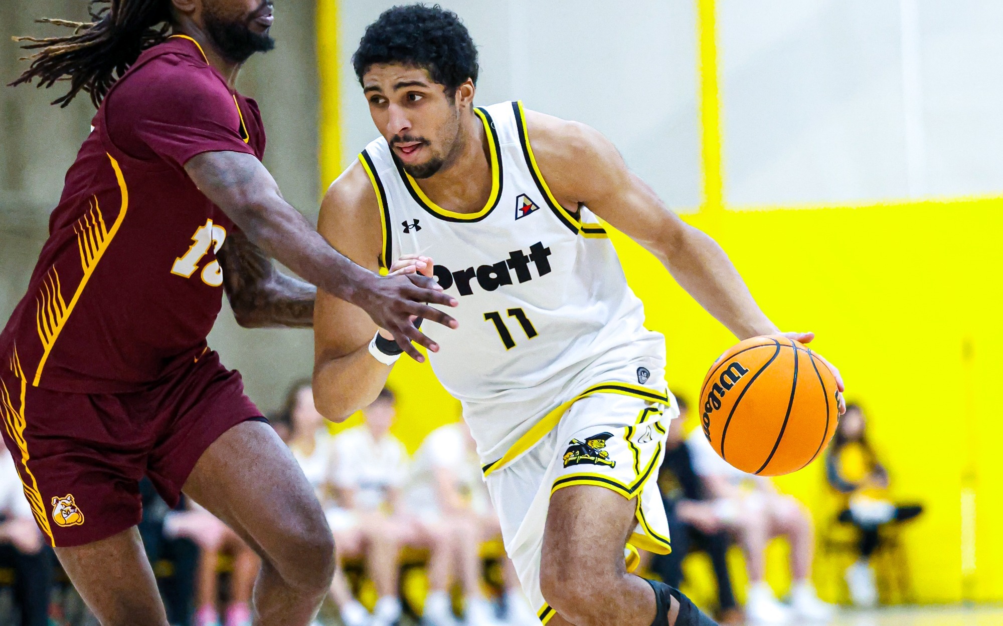 Trey Phillips drives to the basket with his left hand