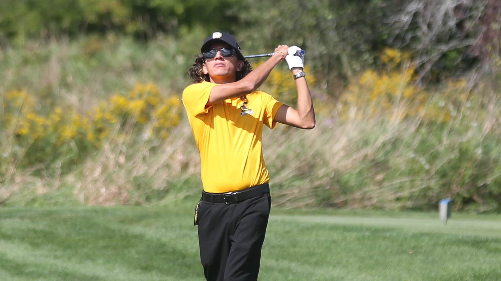 Byron Campos watches his iron shot