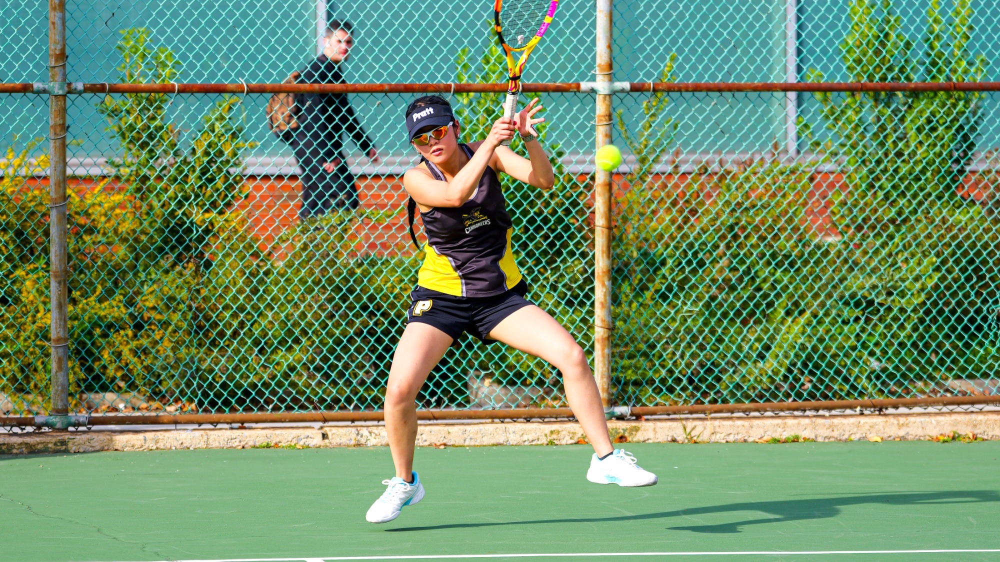 Olivia Tao hits a baseline forehand