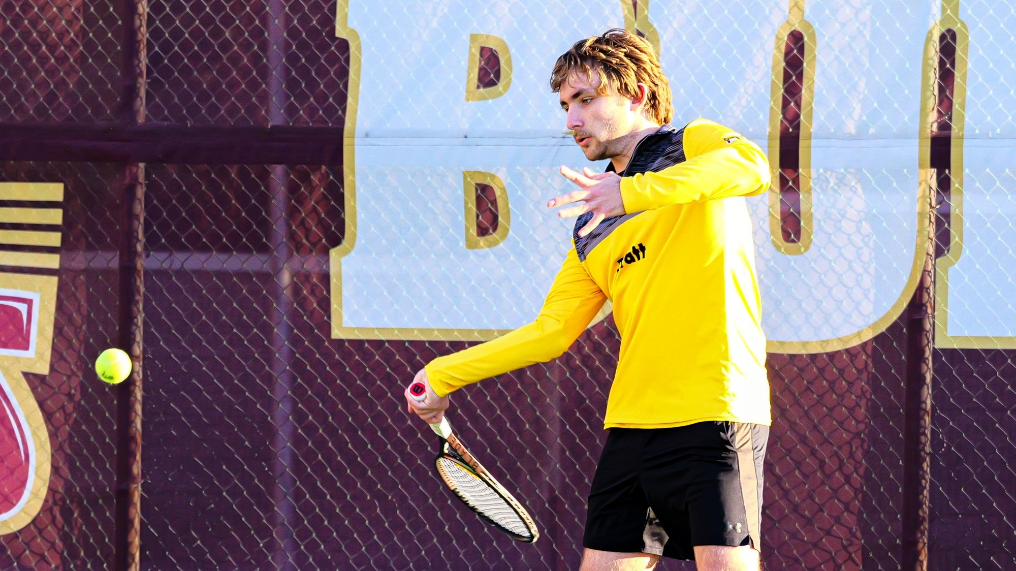 Wyatt Myers focuses on the ball while hitting a right-handed forehand