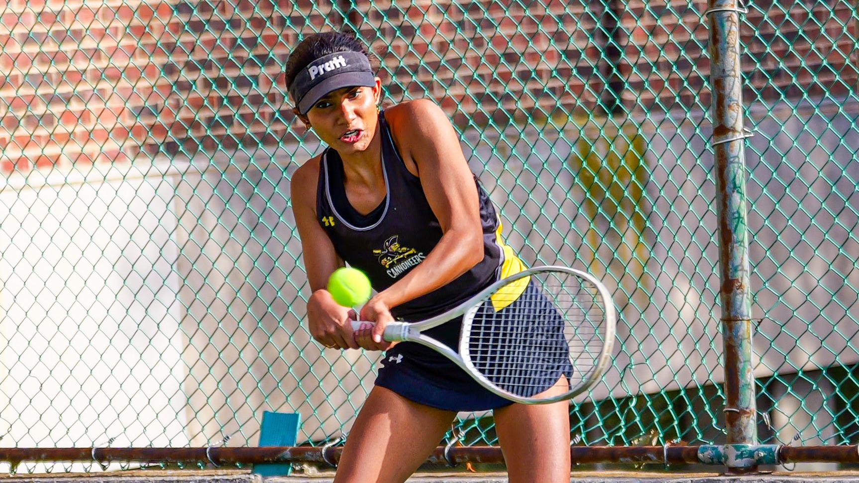 Pallavi Verghese hits a two-handed backhand