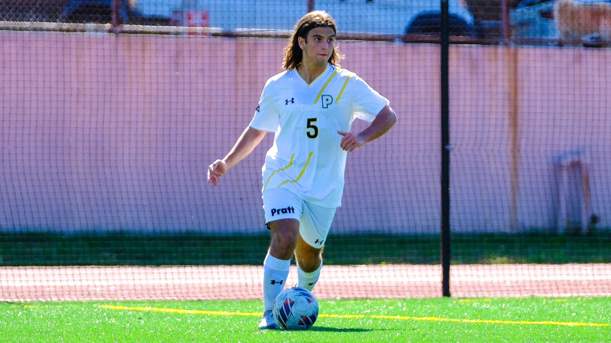 Alex Abbruzzese looks to pass from deep in his defensive end.