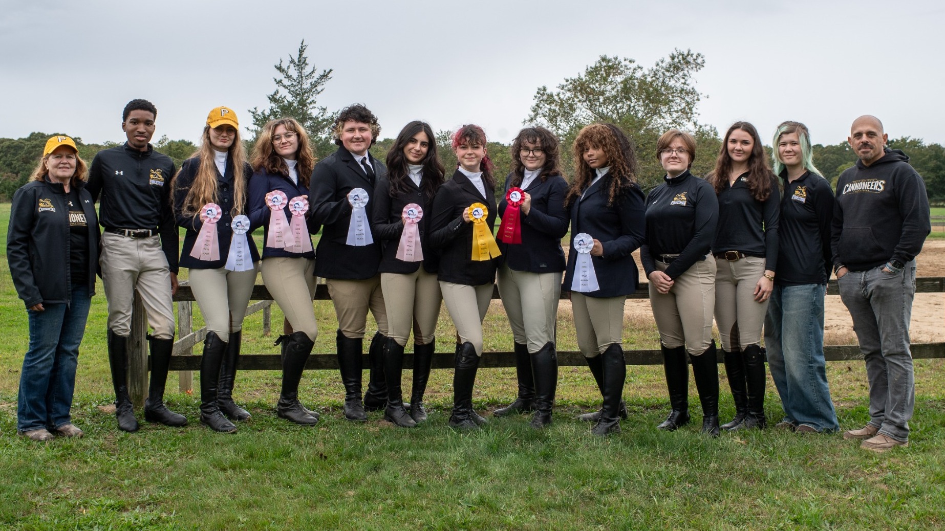 Equestrian poses with their ribbons after the St. Joseph's show