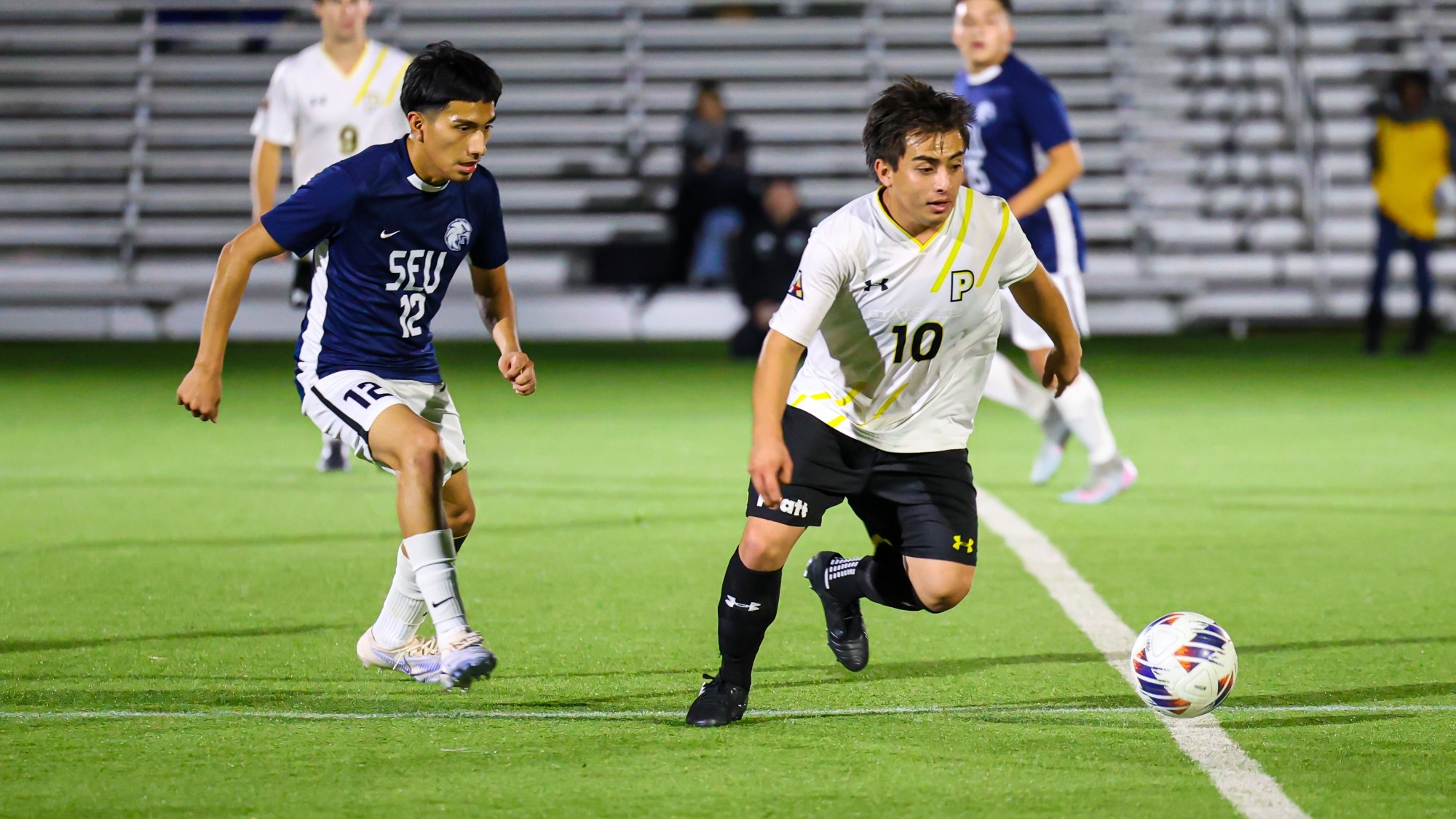 Bryan Hong-Dominguez chases a loose ball with a St. Elizabeth defending looking on