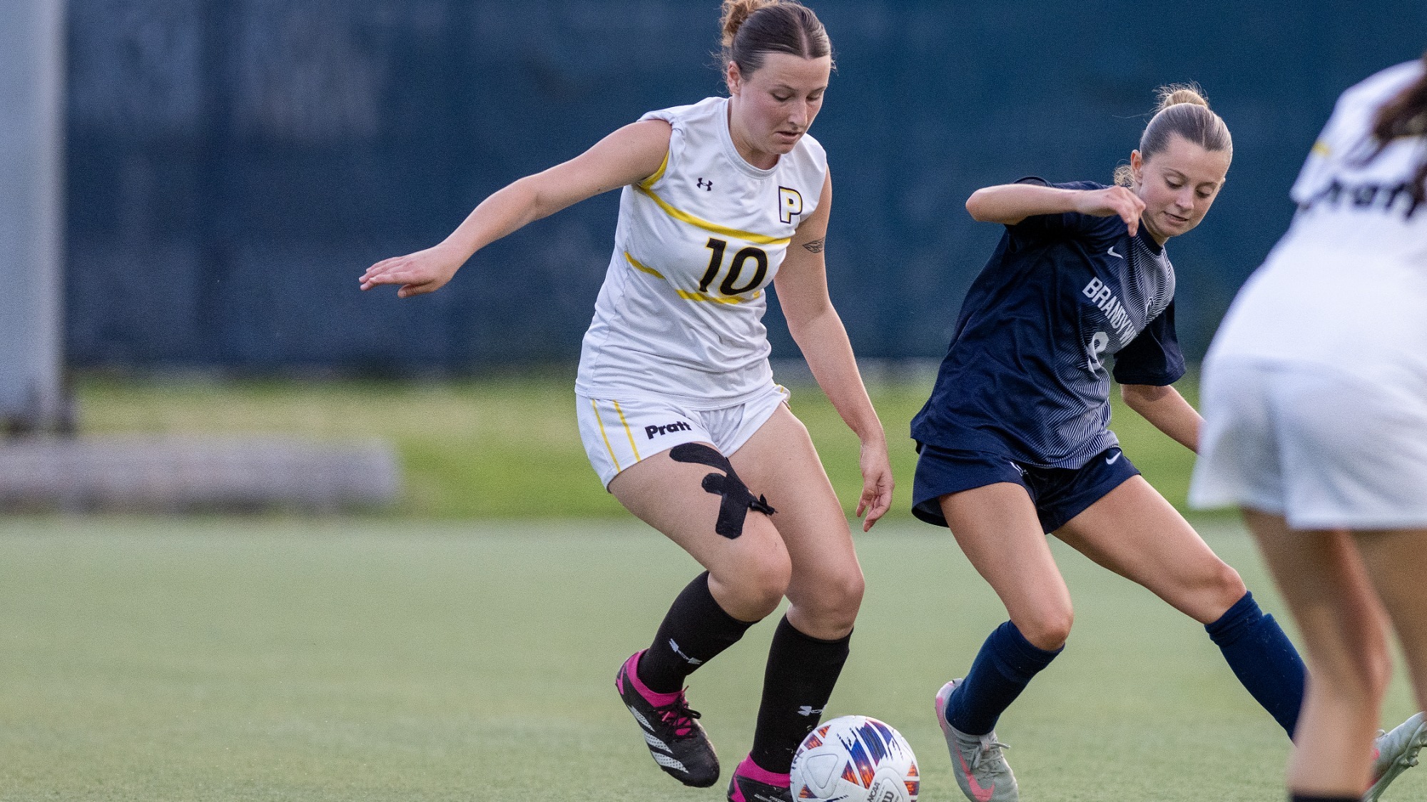 Esme Falk dribbles near a Penn State Brandywine defender.