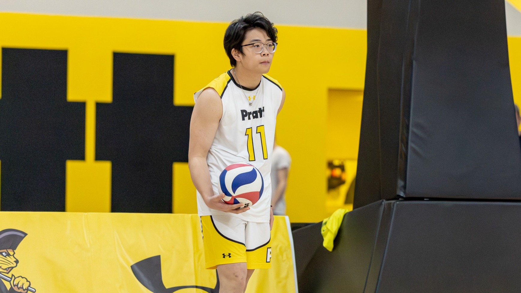 Matthew Zhang prepares to serve