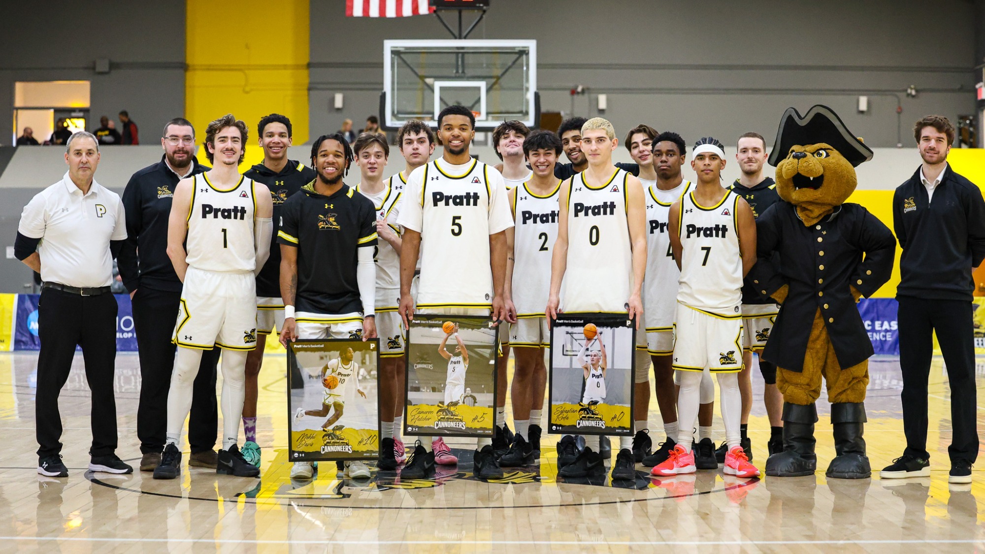 The Pratt Men's Basketball team poses on Senior Day around their three seniors.