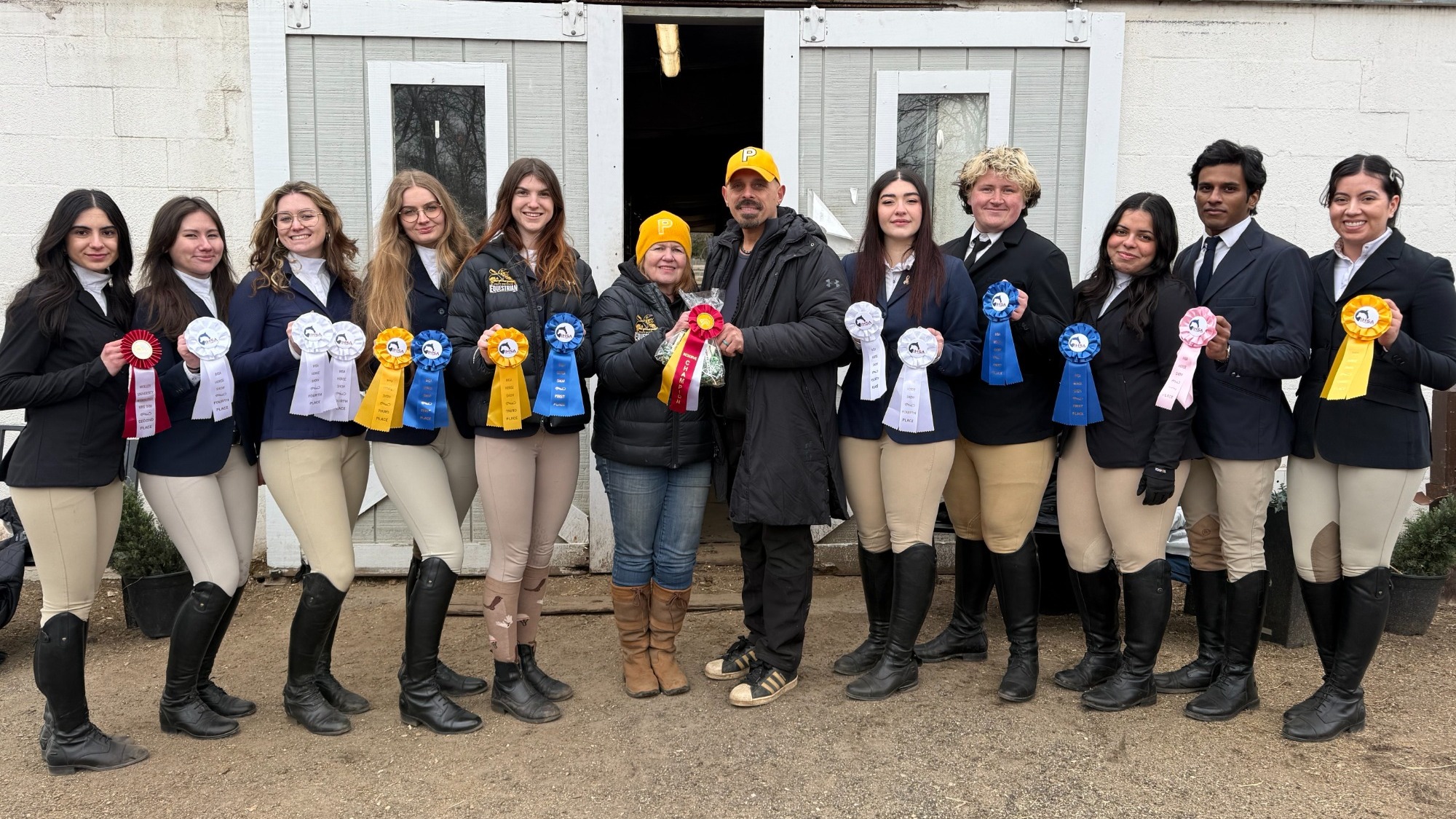 Pratt holds their ribbons after the Adelphi & Molloy Universities Show