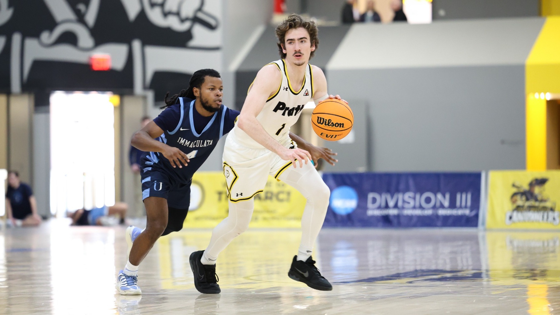Thomas Graetz dribbles past an Immaculata defender
