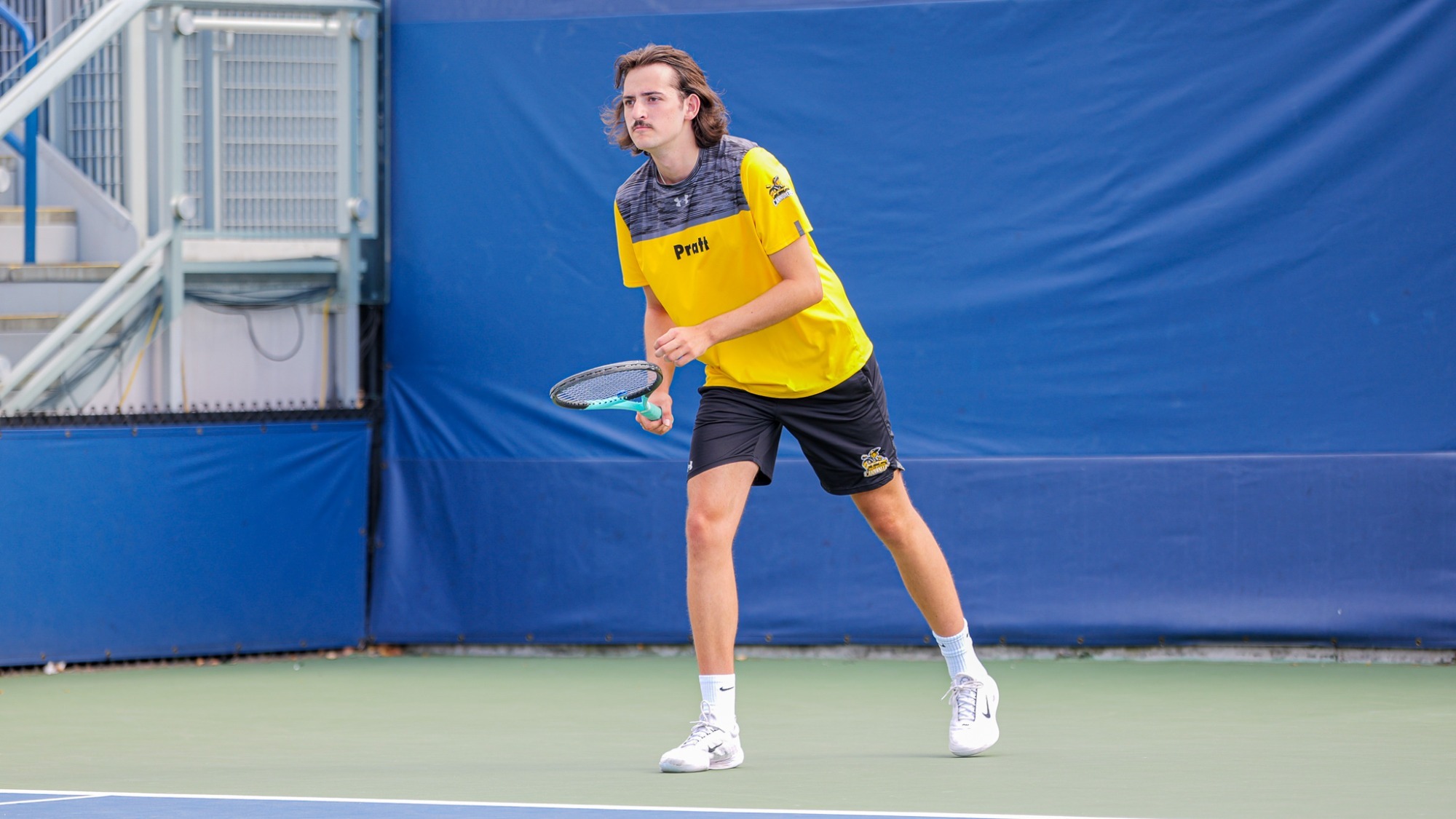 Caleb Callahan awaits to return serve