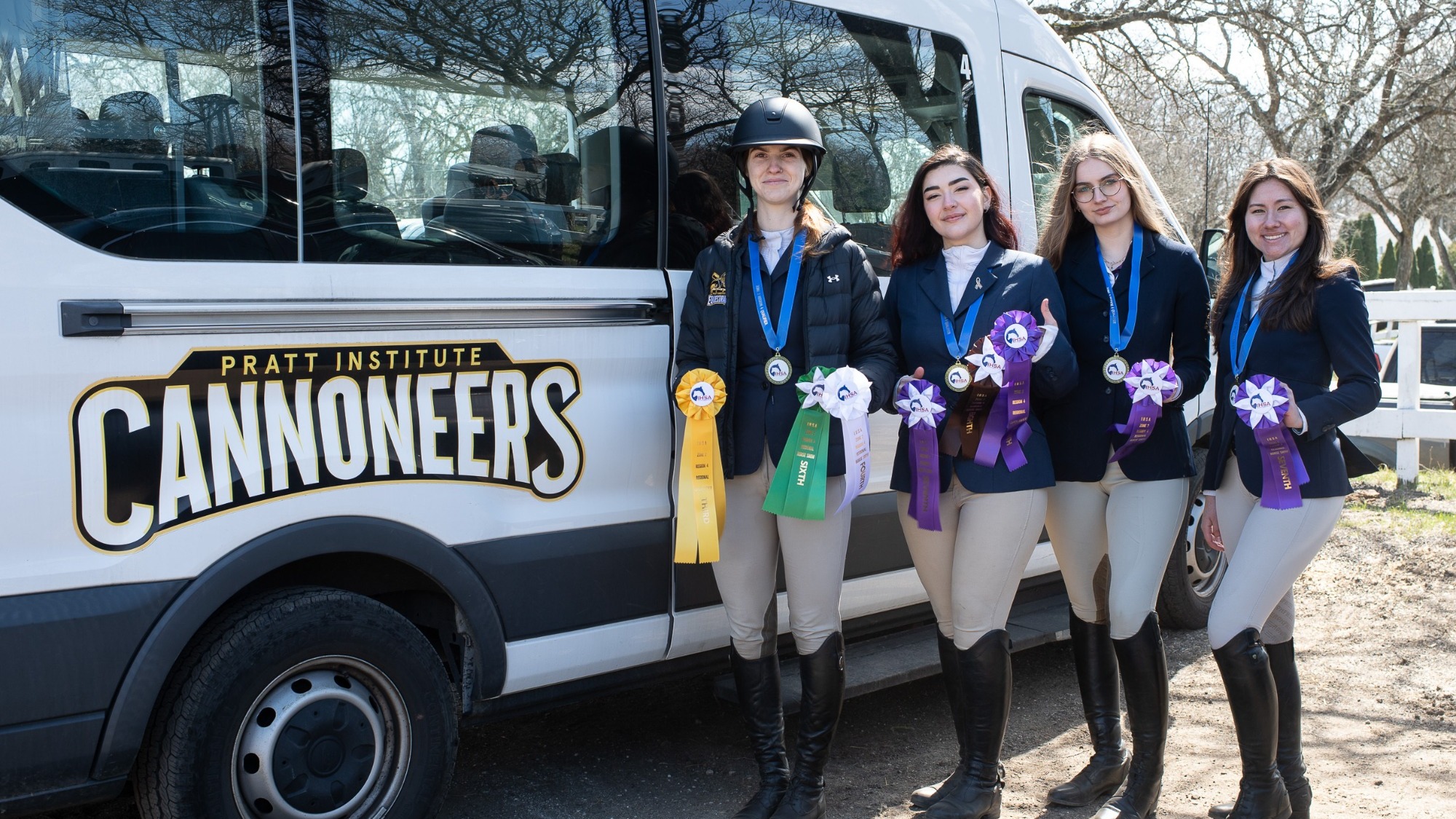Equestrian's four regional qualifiers pose with their ribbons after IHSA regionals