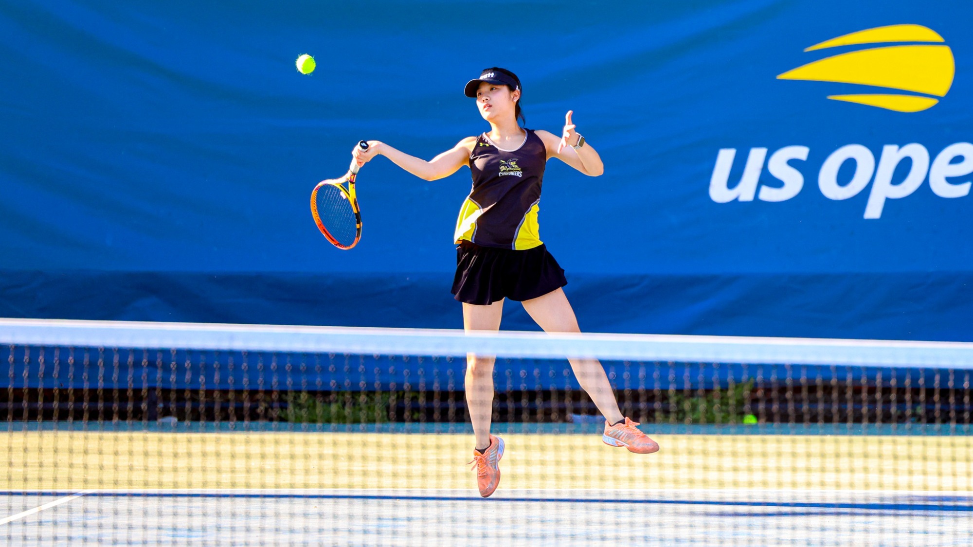 Olivia Tao hits a right-handed forehand from the baseline