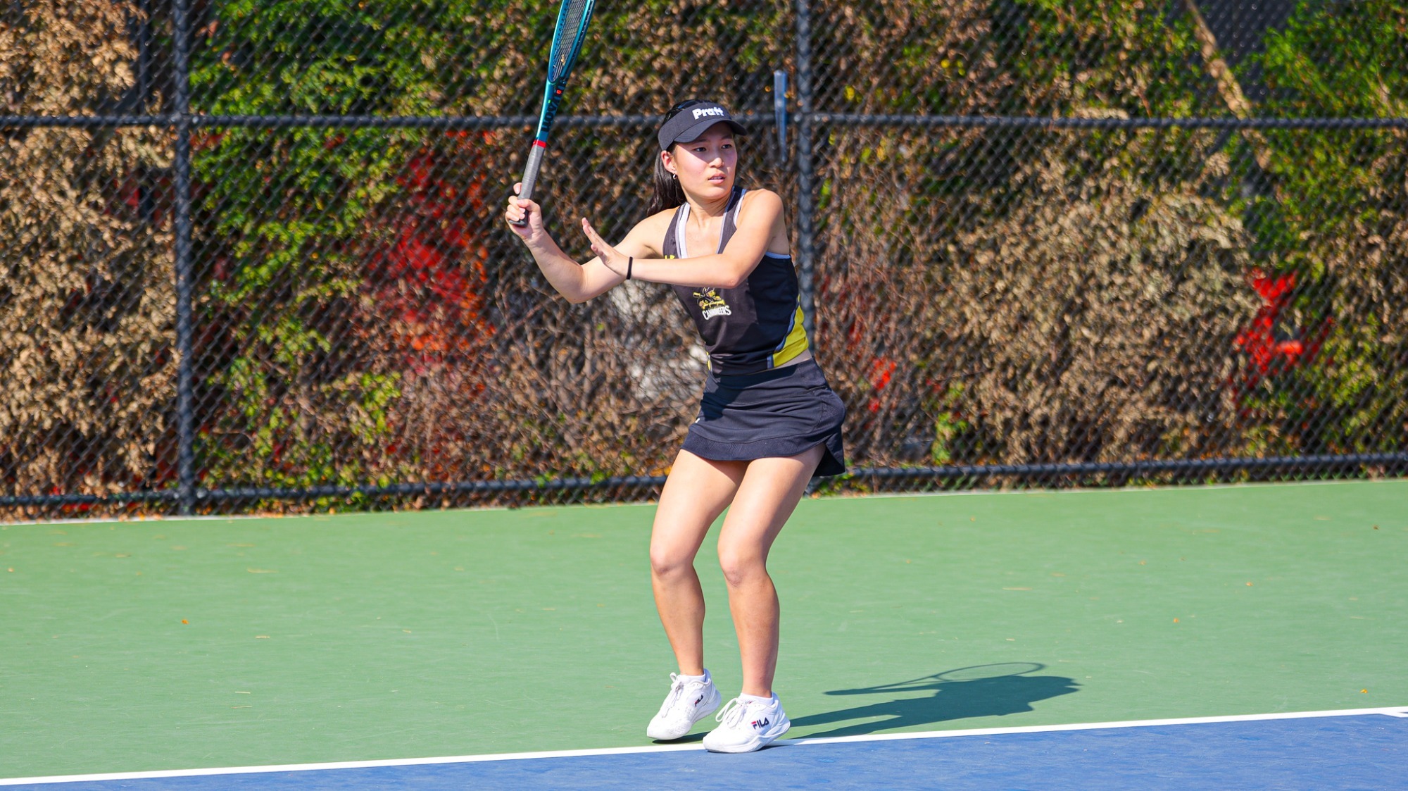 Judith Song prepares to his a baseline forehand