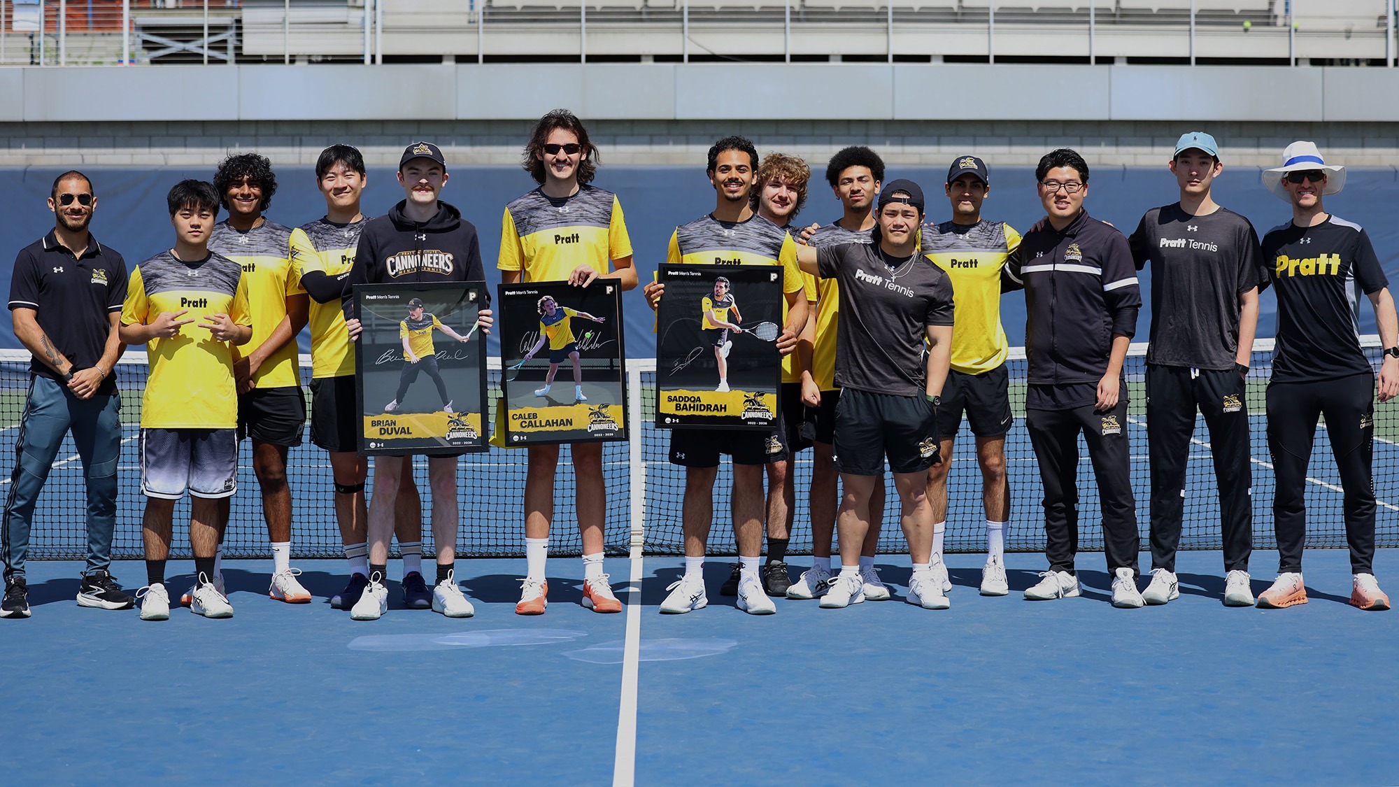 Men's Tennis poses with their seniors holding their senior posters at center court prior to their regular season finale vs. Marymount.