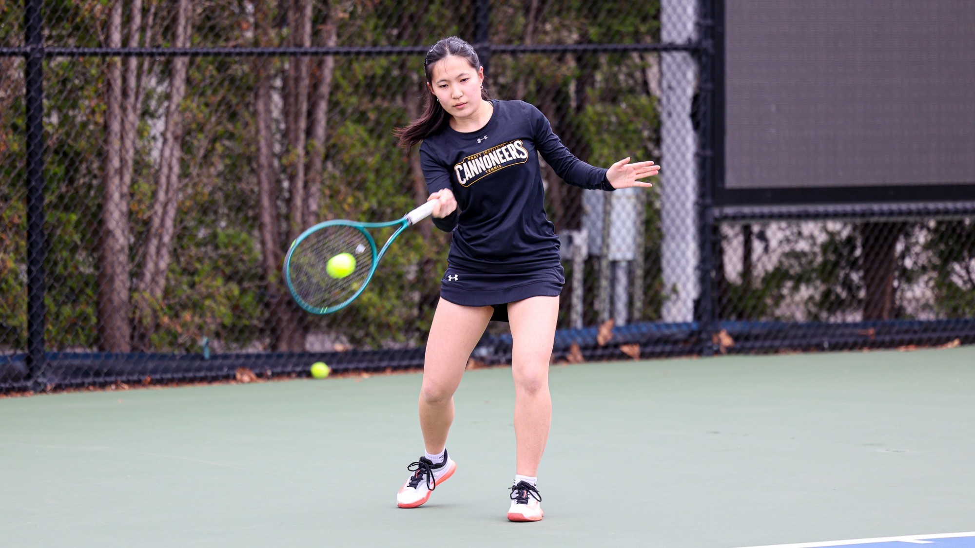 Judith Song hits a forehand from the baseline.
